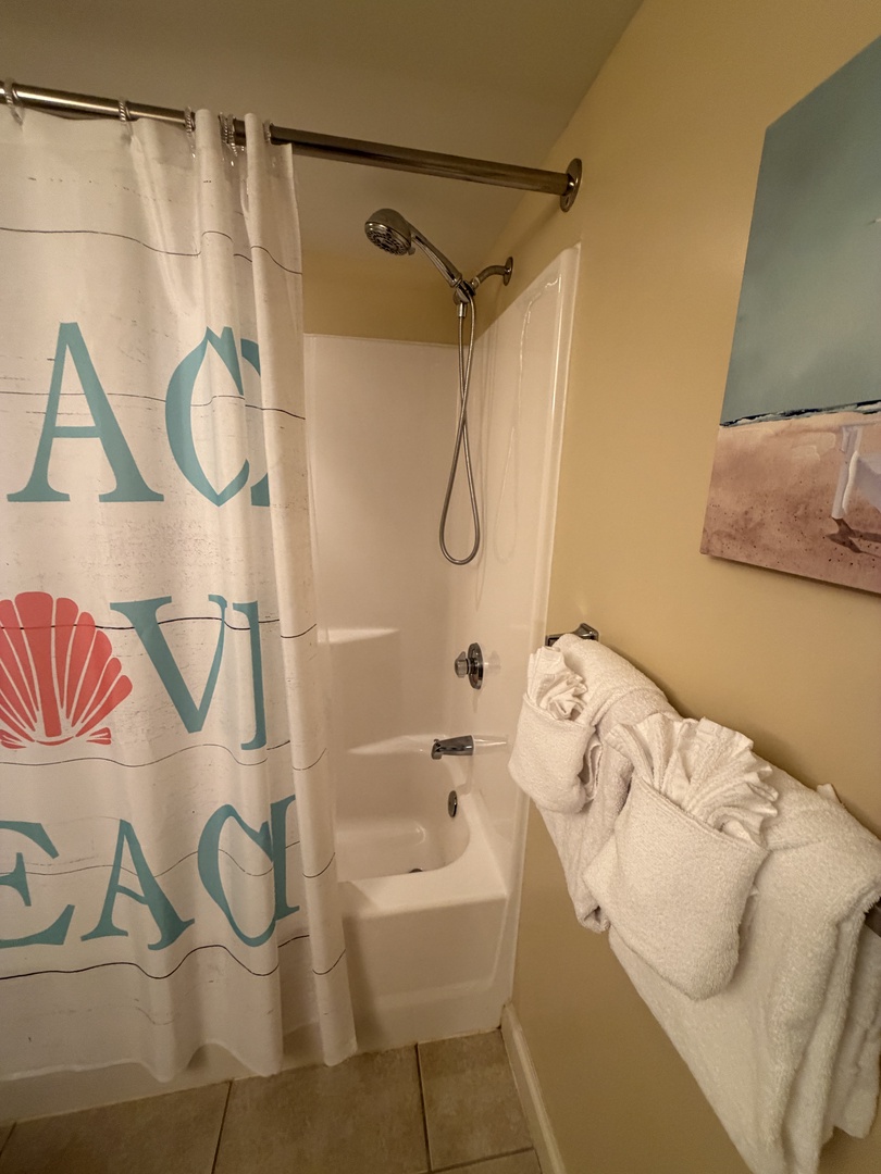 Relax in your deep soaking tub with fluffy towels at arm's reach for the ultimate bath experience.