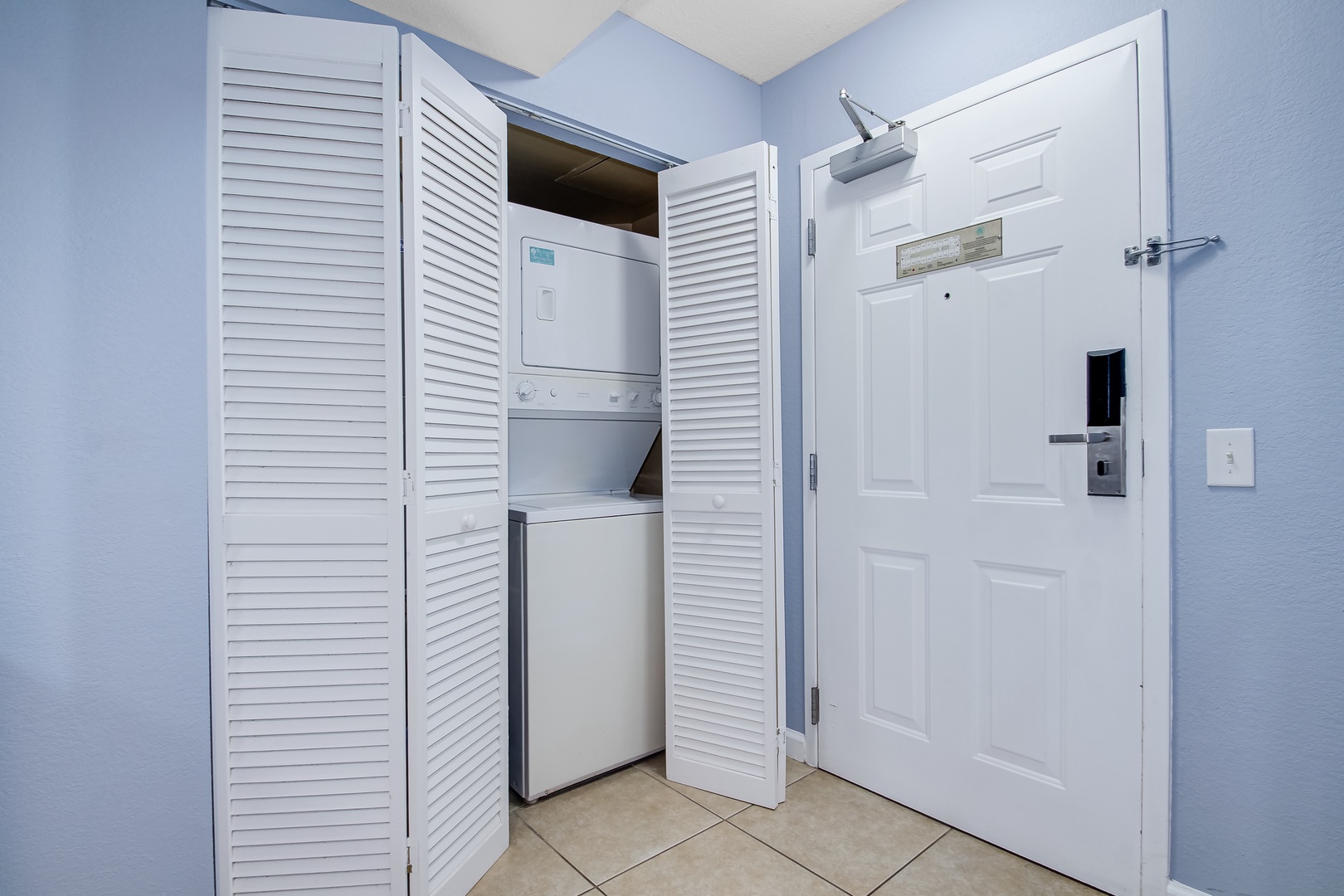 Convenient in-unit laundry tucked behind elegant louvered doors keeps your vacation wardrobe fresh and ready for every adventure.