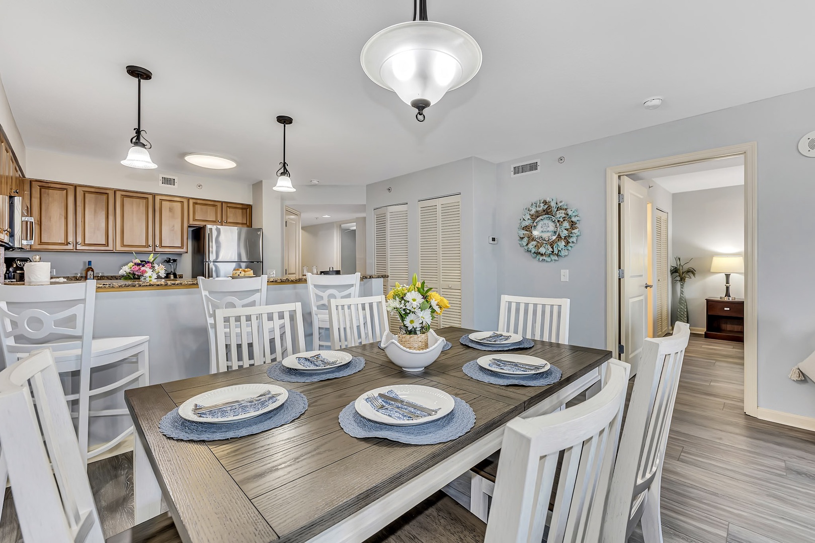Gather around this inviting dining table where coastal charm meets everyday comfort. With seating for eight and a fully equipped kitchen just steps away, you'll love hosting meals here during your stay.