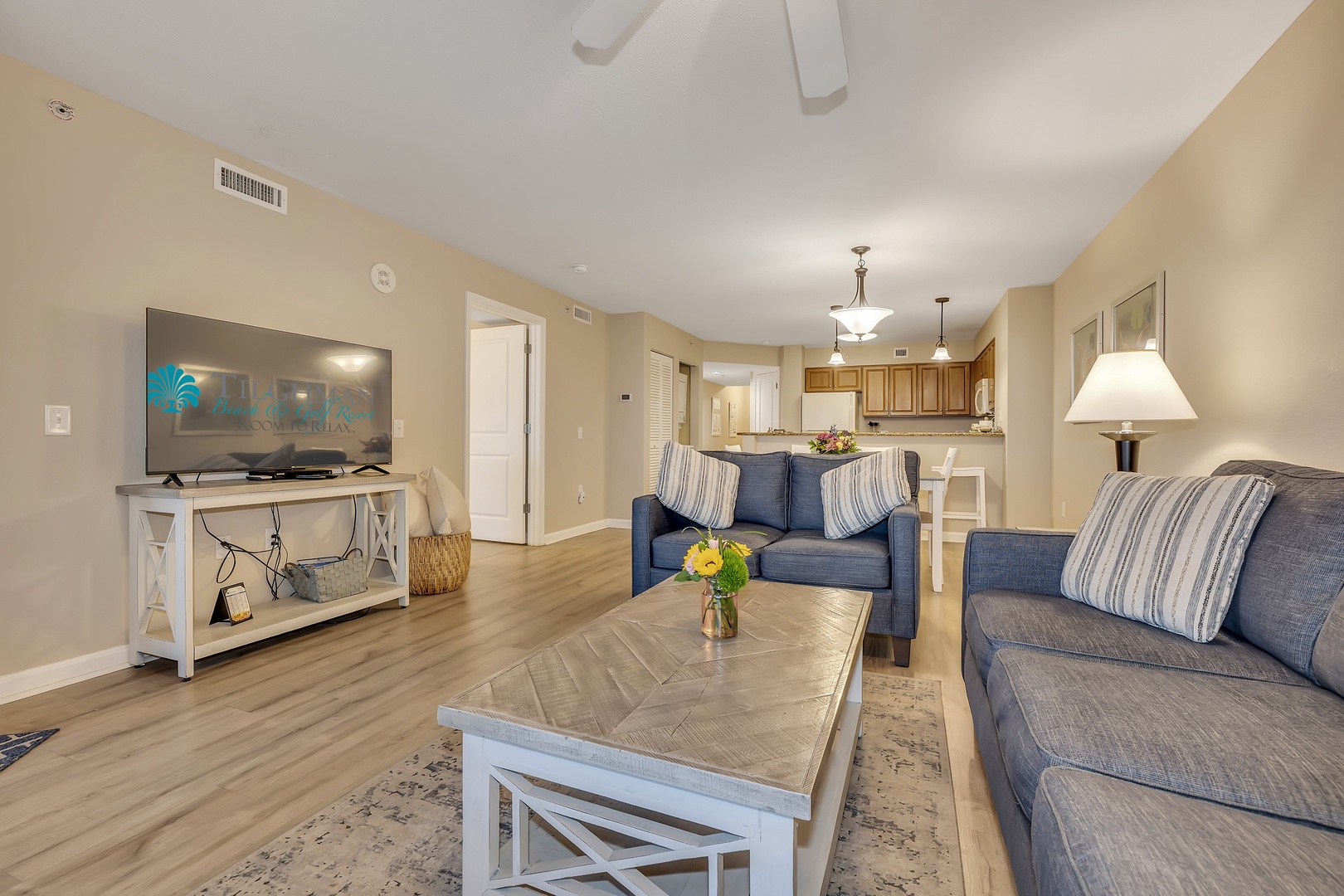 Unwind in your spacious open-concept living area with soaring ceilings and plenty of natural light. Settle into the plush seating, enjoy your favorite shows, and feel right at home in this comfortable, inviting space.