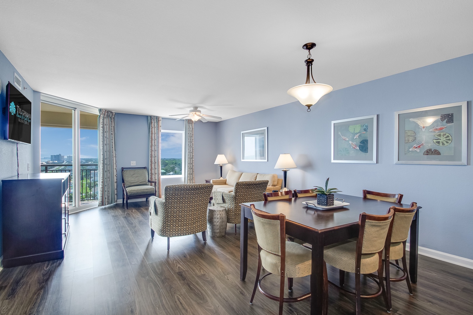 Your spacious living and dining area features comfortable seating, elegant furnishings, and panoramic windows that frame stunning views beyond.