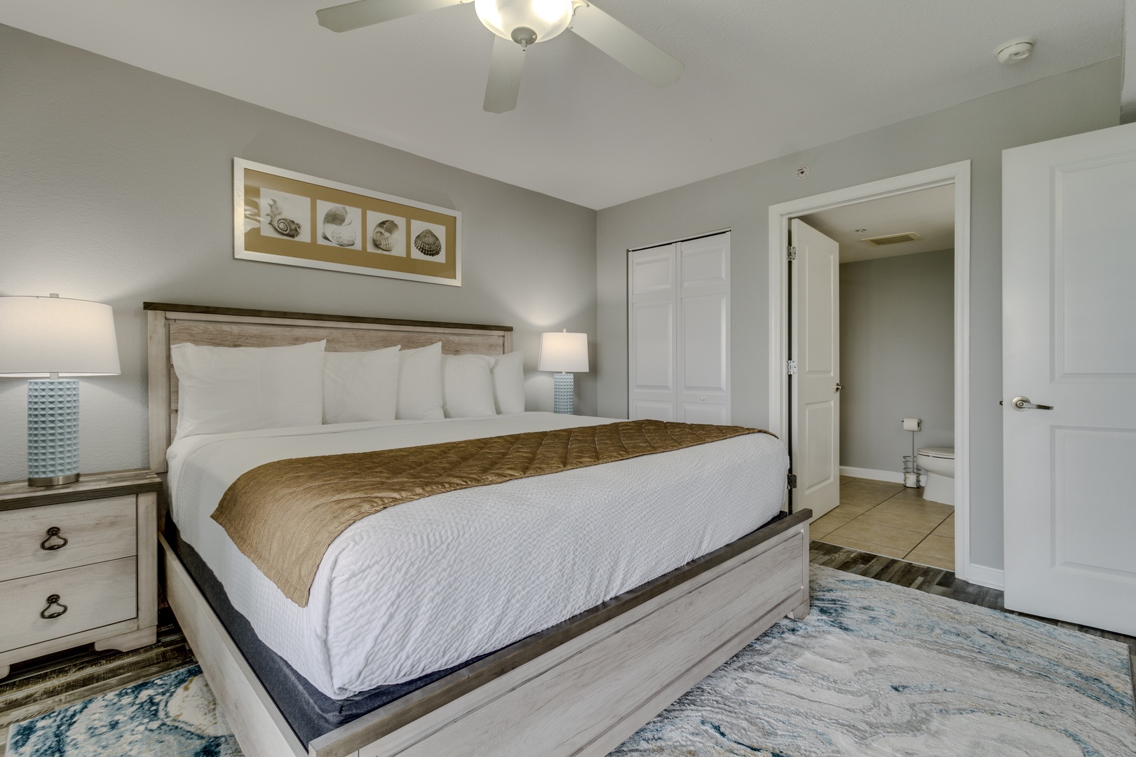 Unwind in your peaceful sanctuary with a plush king bed, cozy lighting, and thoughtful coastal touches.