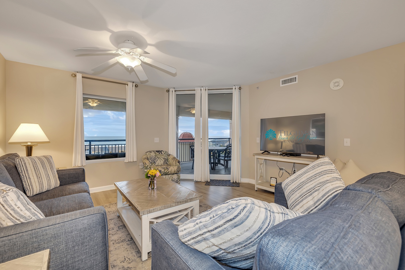 Sink into soft seating and let the ocean breeze drift through your private balcony doors. Your coastal escape awaits with sweeping sea views framing every relaxing moment.