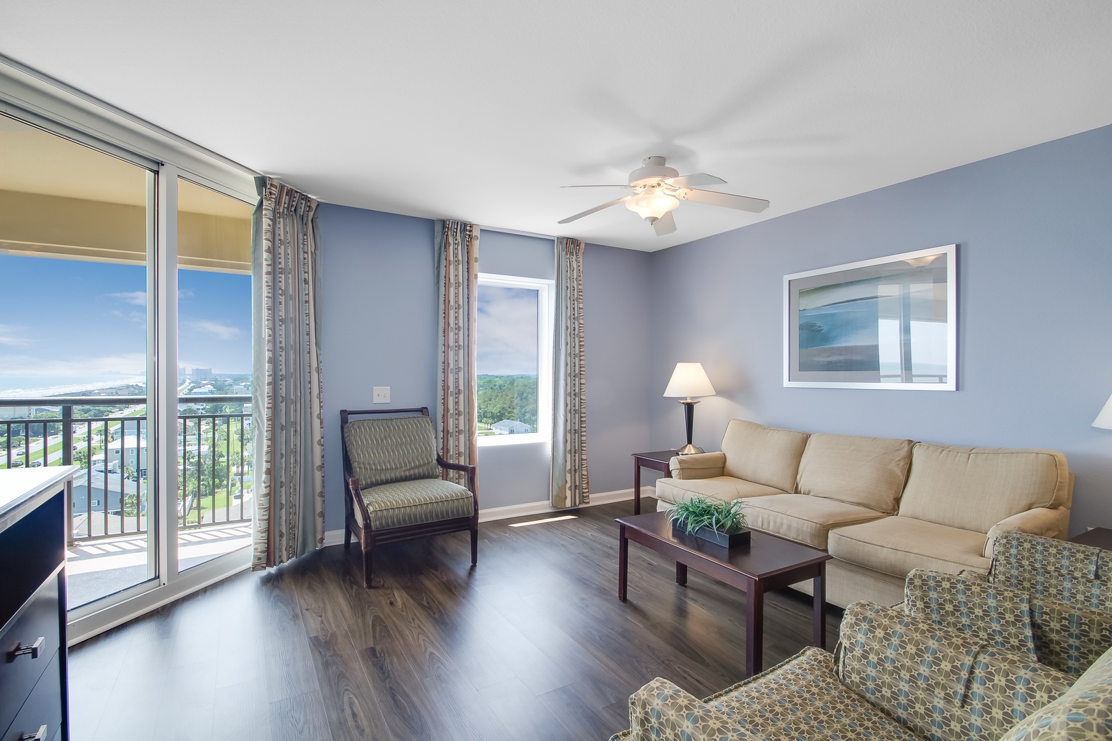 Unwind in your spacious living room with plush seating and peaceful mountain views from your private balcony.