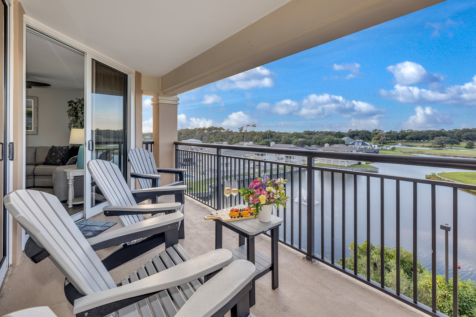 Settle into your private balcony with Adirondack chairs and take in sweeping water and golf course views—perfect for morning coffee or watching clouds drift by in the afternoon breeze.