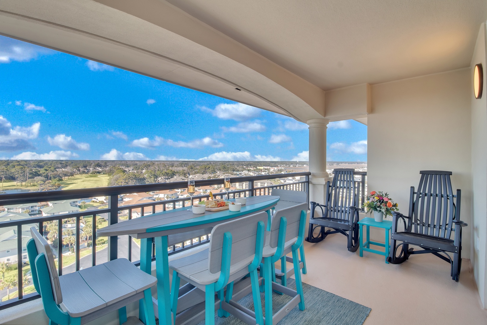 Your private balcony offers stunning elevated views while you dine al fresco or unwind in comfortable seating.