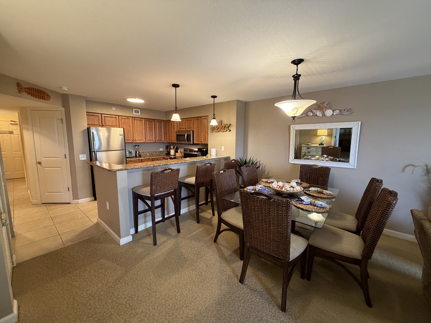 Gather around your spacious dining table for memorable meals, while the fully equipped kitchen with granite counters makes cooking together a joy.