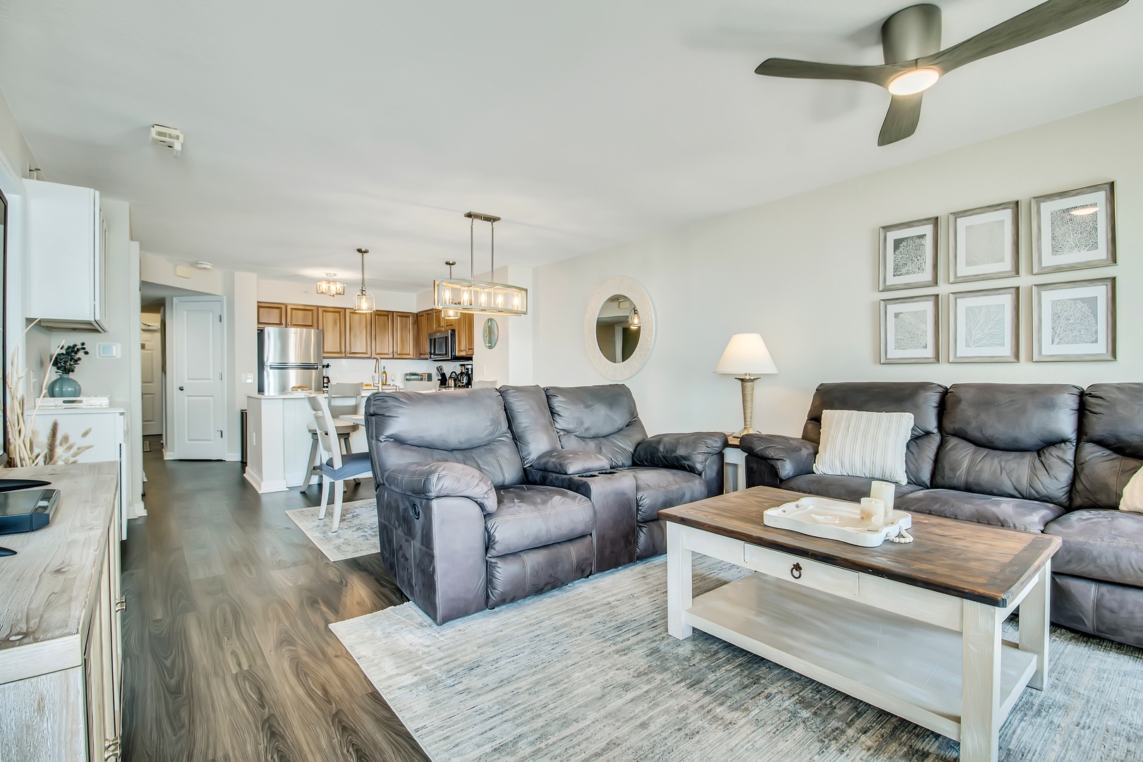 Sink into plush leather recliners in your open-plan living space, where modern comfort meets coastal elegance with thoughtful touches throughout.