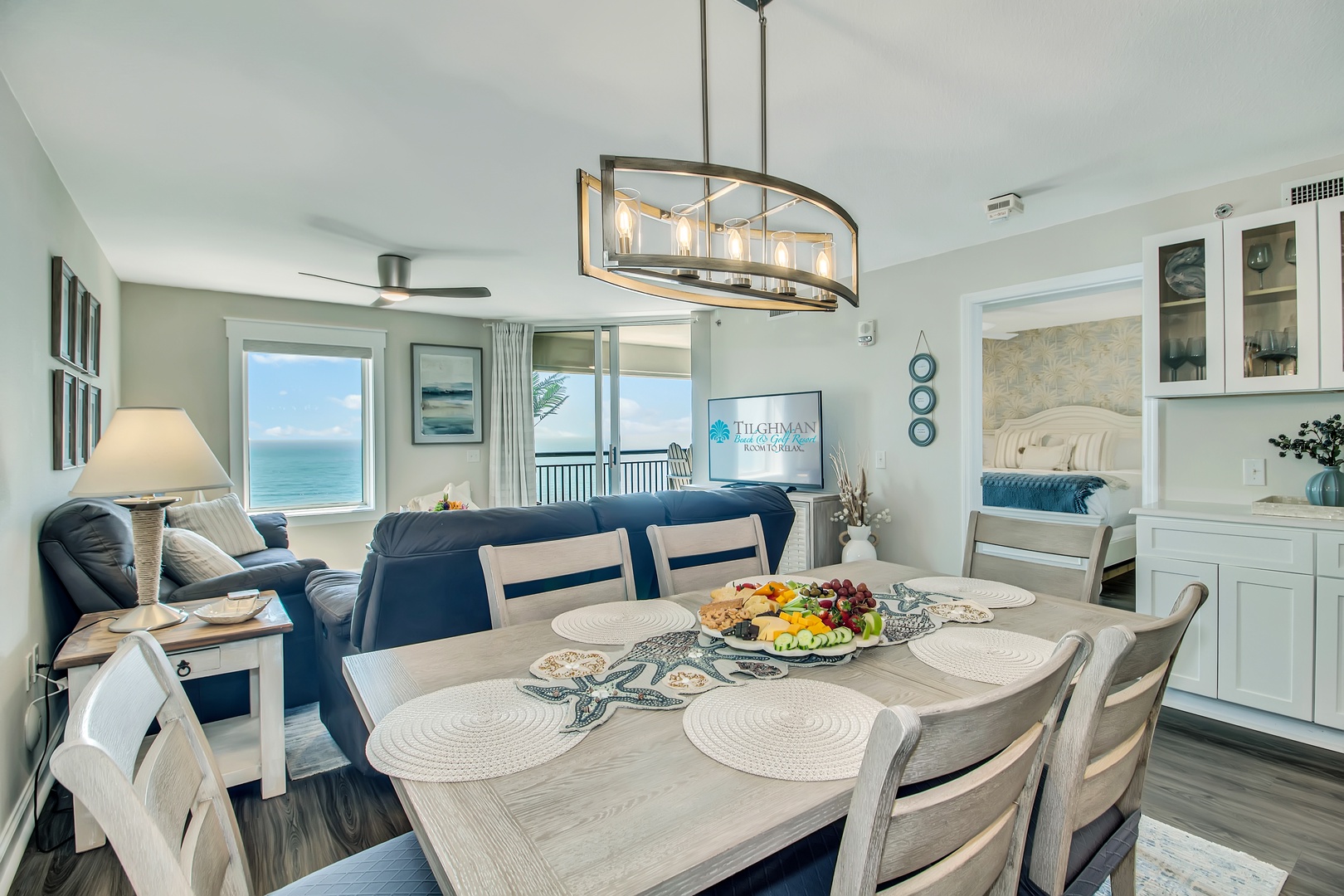Your elegant dining space flows seamlessly into the living area, creating perfect moments for shared meals with breathtaking ocean views framing every gathering.