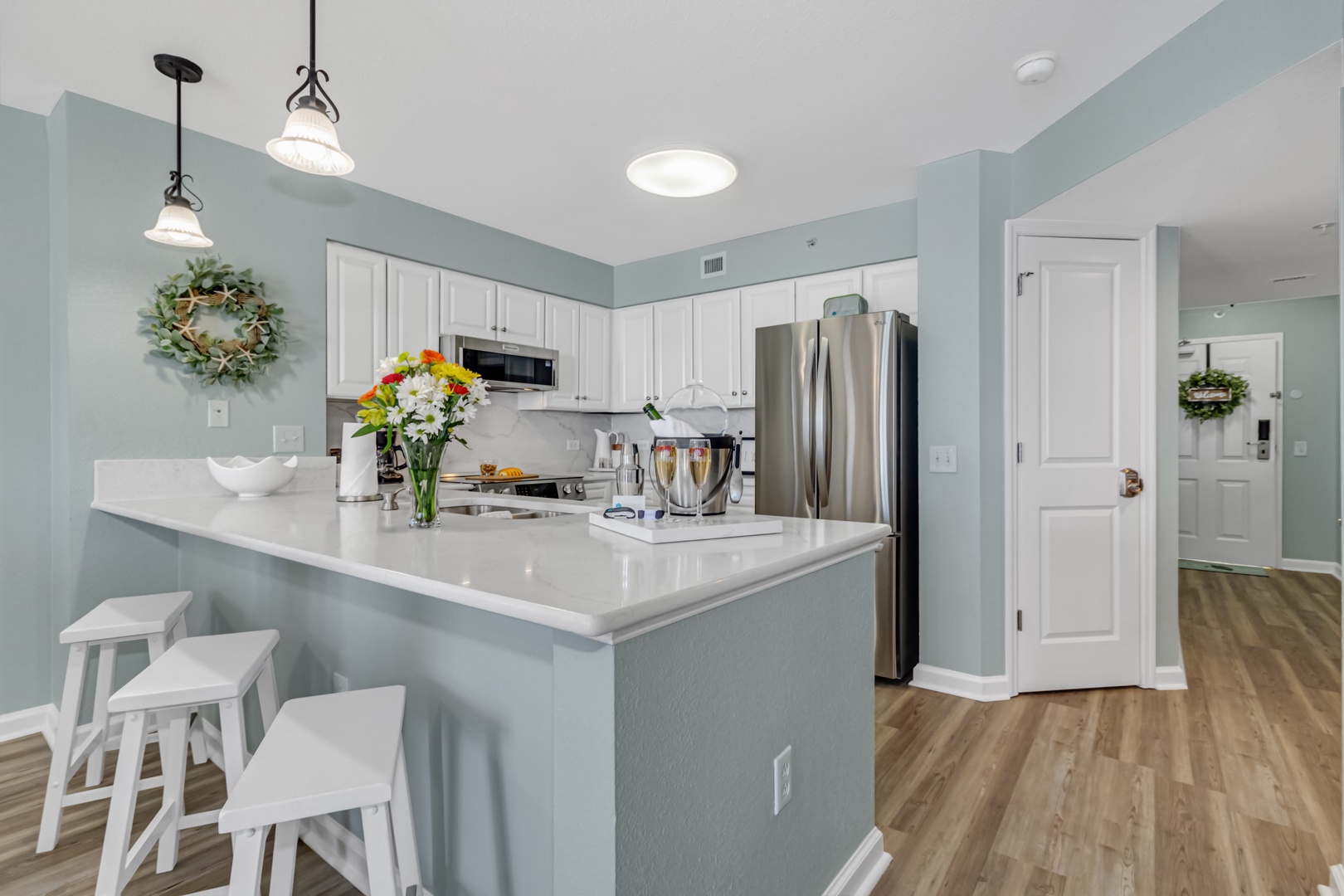 Your bright kitchen features modern appliances and a spacious island for cooking memorable meals together.