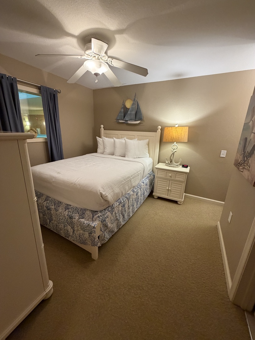 Drift into restful sleep in your comfortable bedroom, complete with crisp linens and soothing ceiling fan for perfect temperature control.