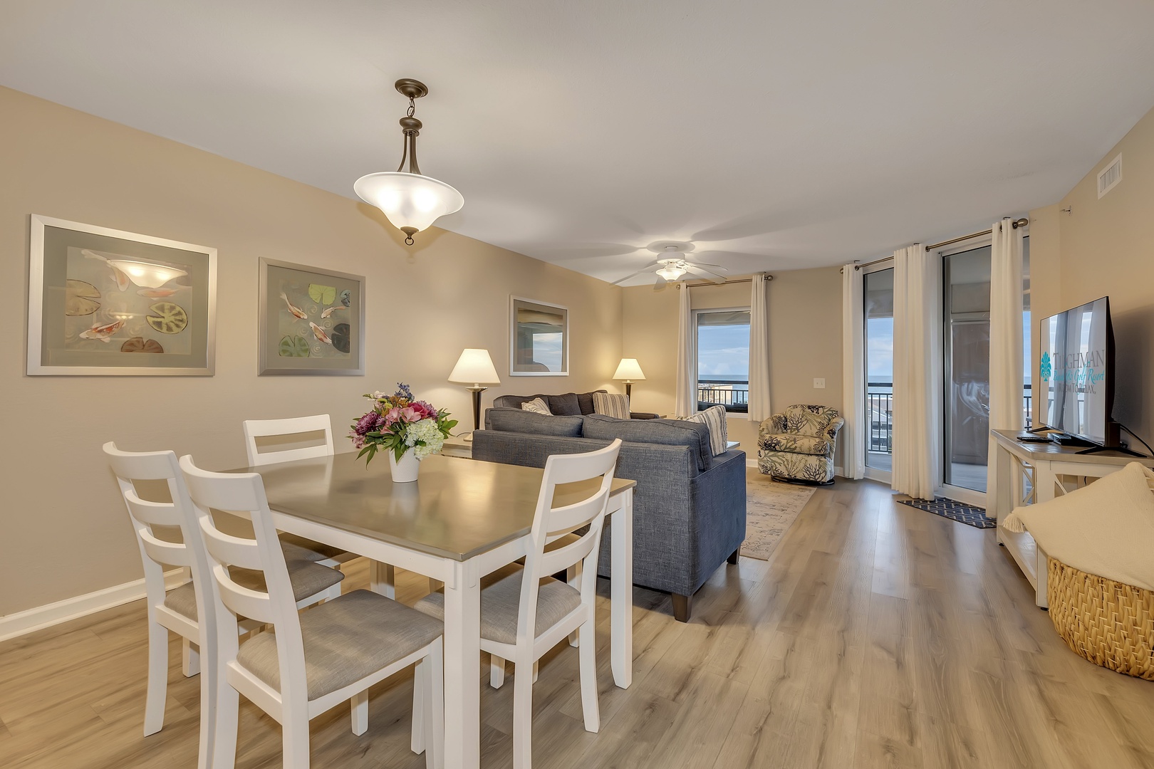 You'll love gathering around the dining table before heading out to your private balcony to enjoy stunning ocean views through the glass doors.
