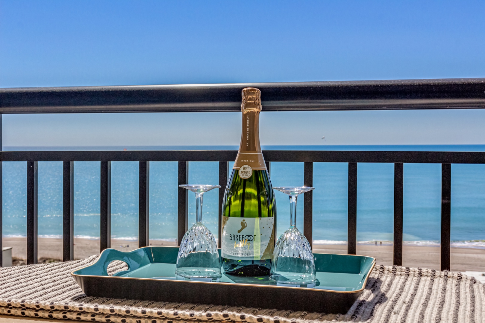 Celebrate with champagne on your private balcony while watching waves dance across pristine sands below.