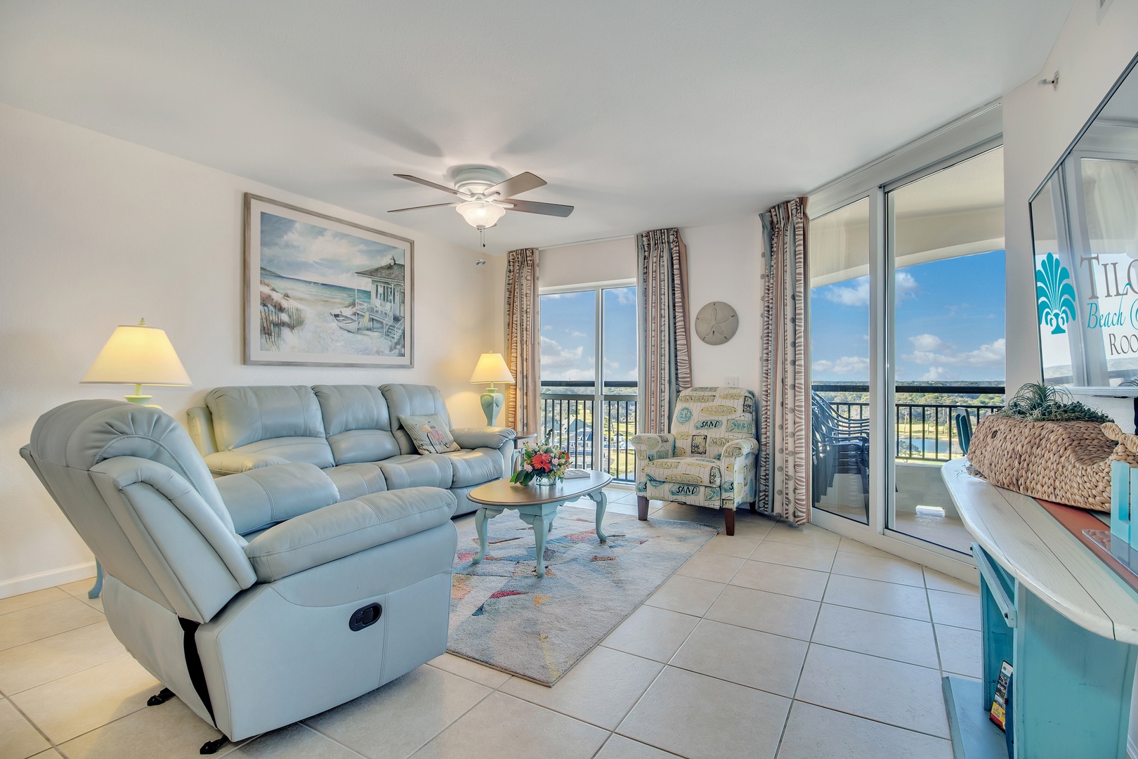 Relax in your coastal living room with ocean views, where soft recliners and beachy vibes create the perfect vacation retreat.