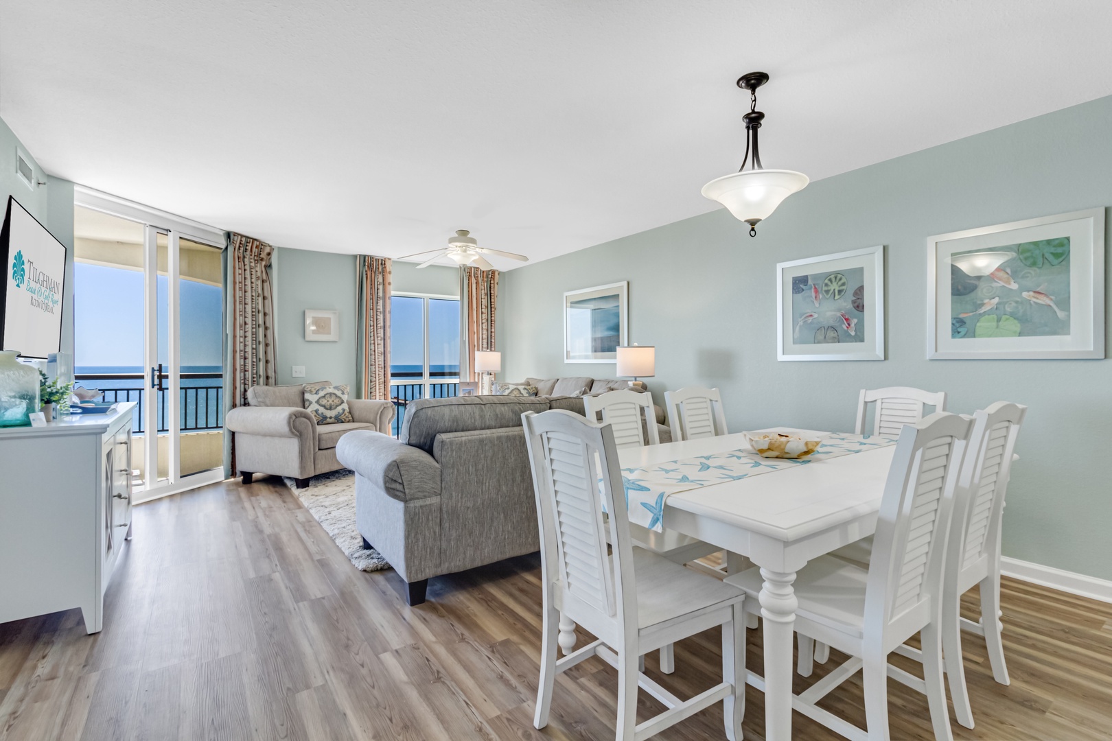 Relax in your bright coastal living space with stunning ocean views from your private balcony and elegant dining for eight.