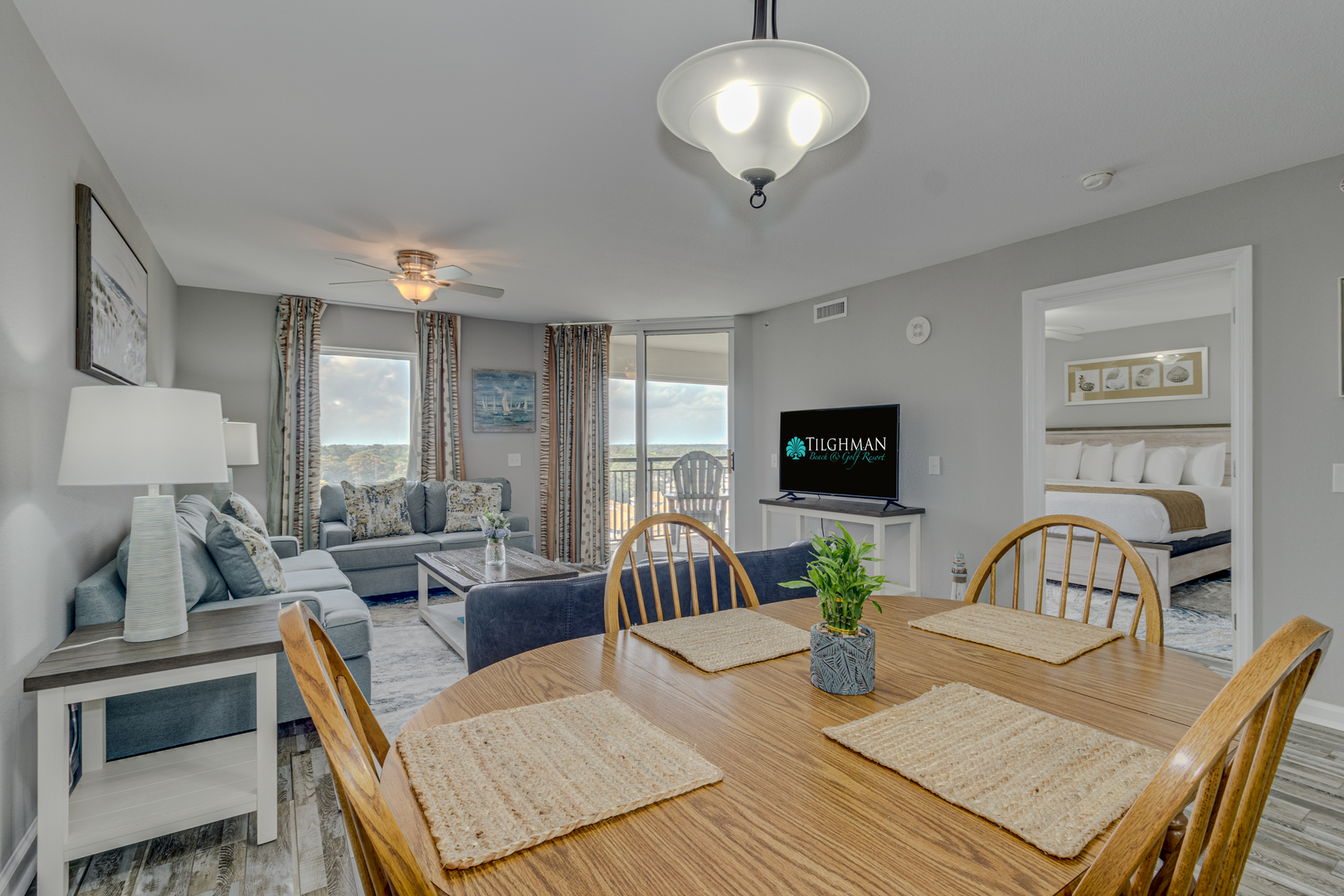 Unwind in your spacious suite with ocean views, cozy seating, and dining for four—your perfect beach getaway awaits.