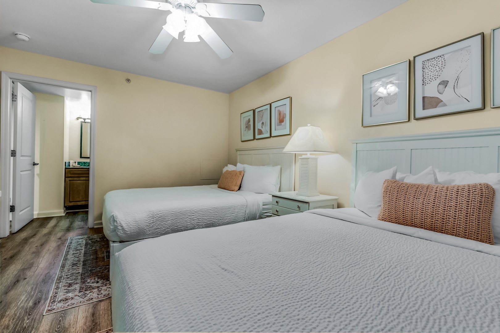 Unwind in your peaceful twin bedroom, where soft linens and coastal charm create the perfect retreat for restful nights.