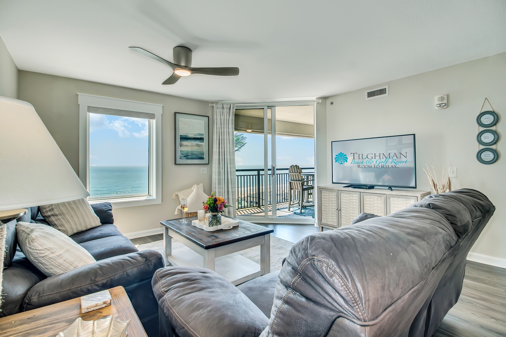 Sink into plush recliners while ocean waves sparkle just beyond your private balcony—your perfect oceanfront escape awaits.