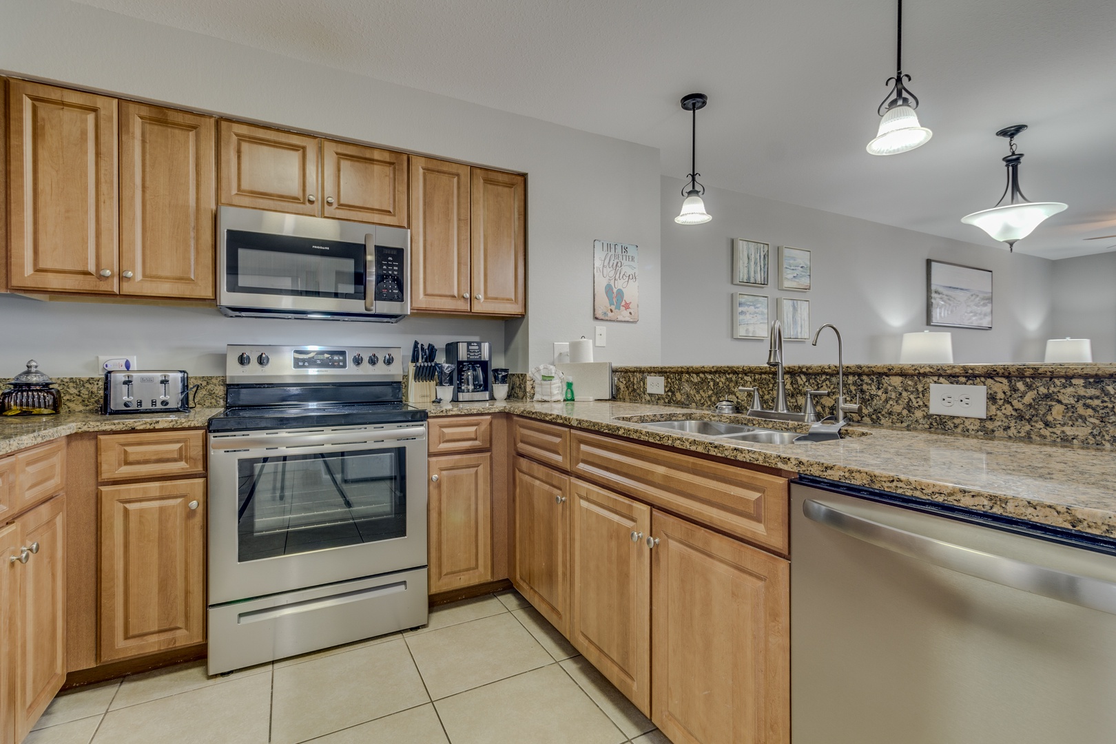 Cook your favorite meals in this fully equipped kitchen with granite countertops, stainless steel appliances, and ample cabinet space for all your culinary needs.