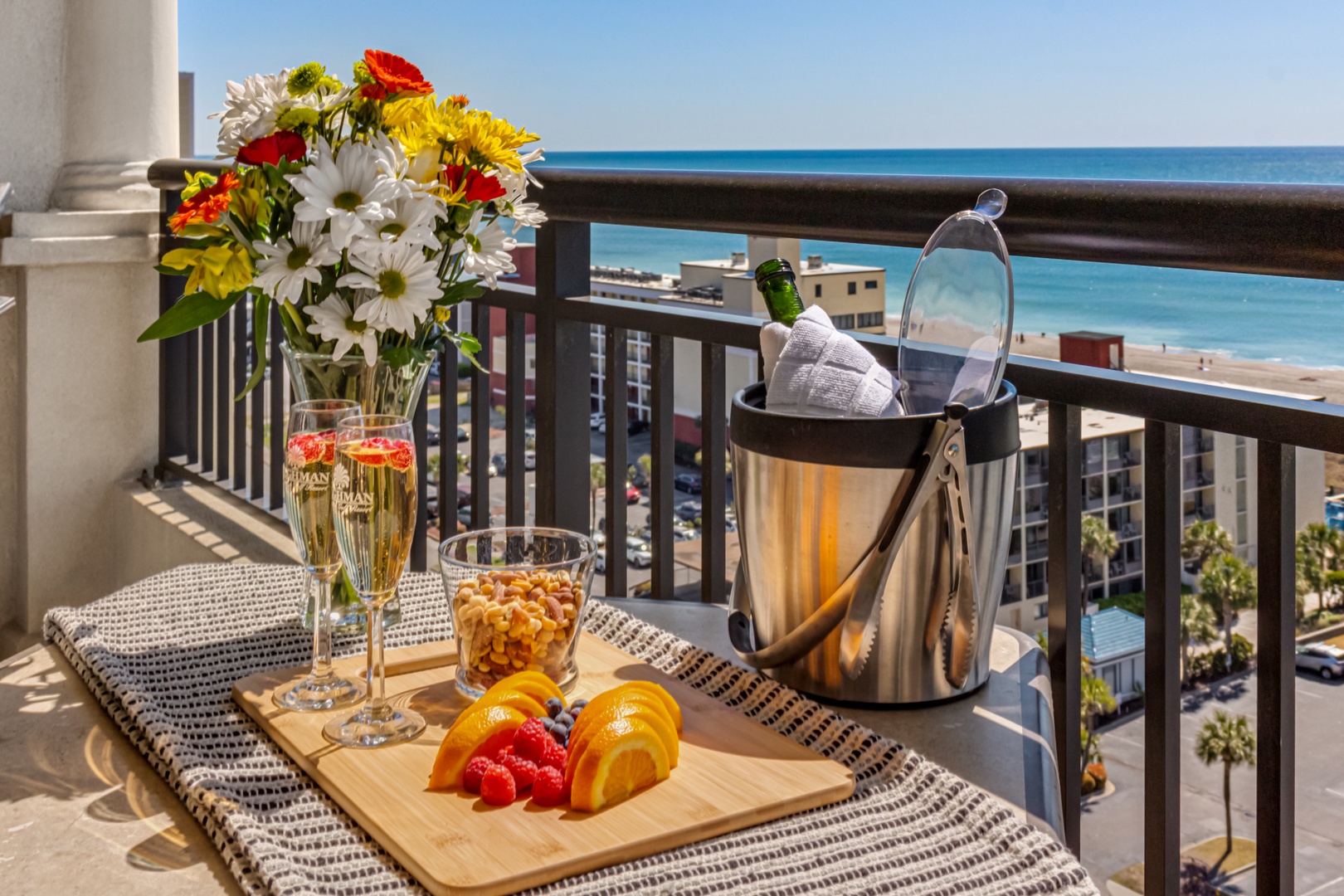 Sip champagne on your private balcony while savoring ocean views and fresh fruit—your perfect romantic retreat awaits.