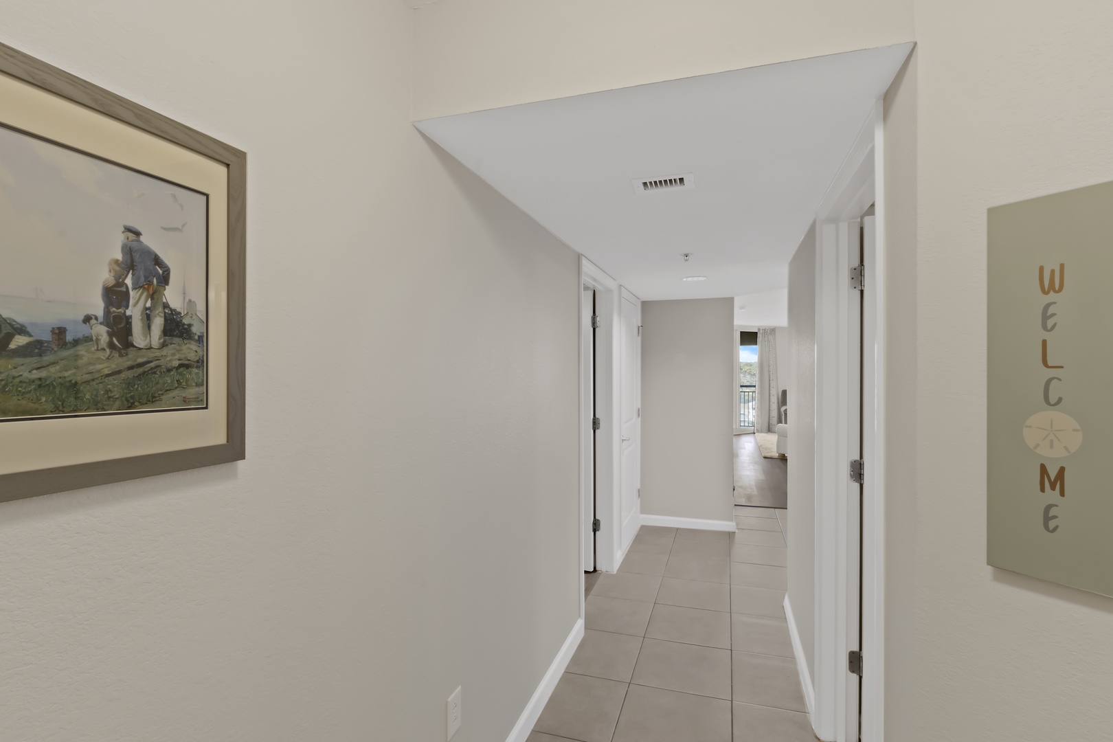 Step into your bright, welcoming hallway where clean lines and thoughtful artwork create an instantly calming atmosphere for your getaway.