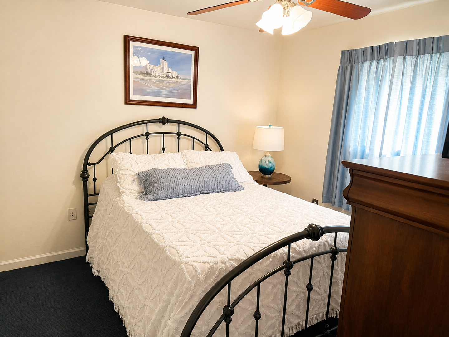 Drift into comfort in your cozy bedroom with plush bedding, gentle ceiling fan, and a peaceful coastal vibe that invites restful sleep after your adventures.