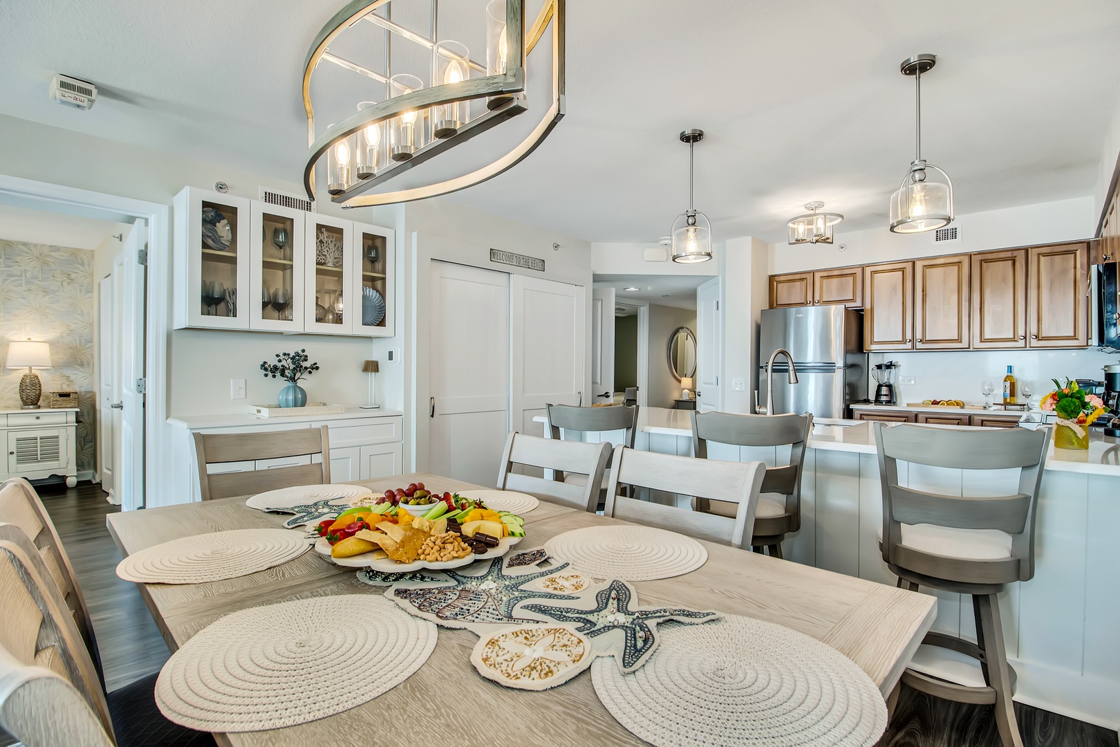Gather around your elegant dining table where coastal charm meets modern comfort—perfect for sharing meals and making memories together.
