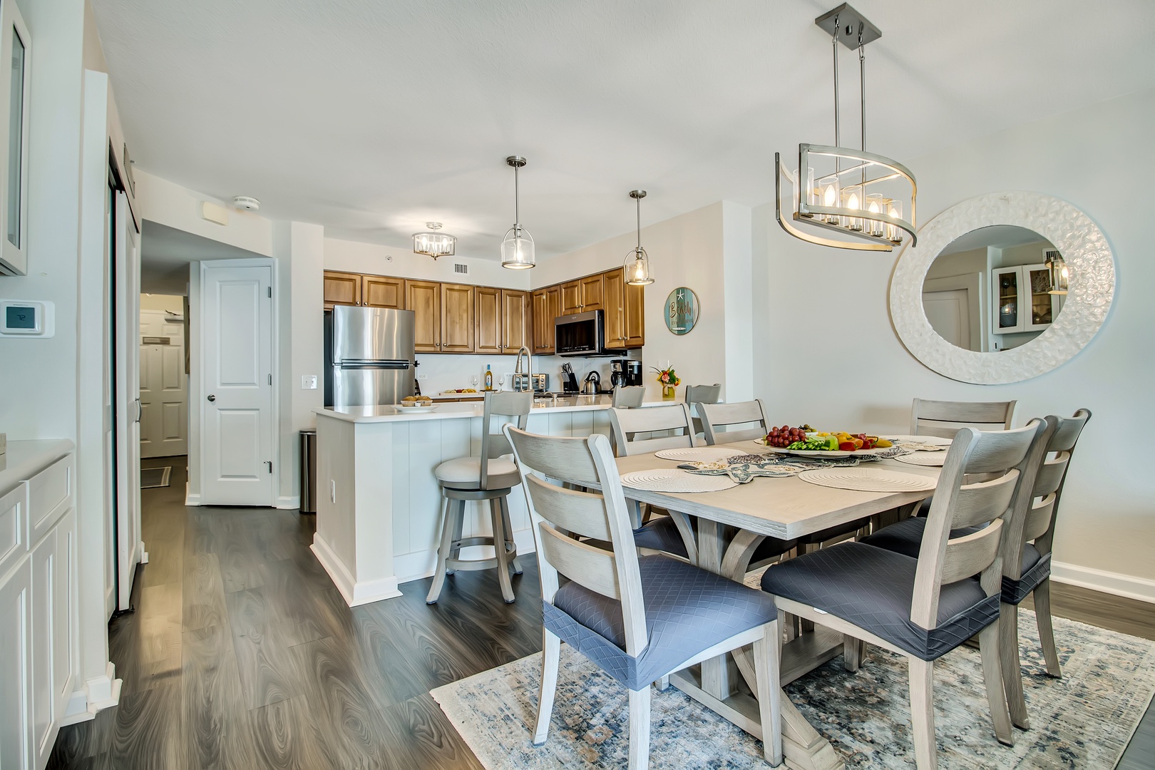 Gather around your spacious dining table while the chef prepares meals in the gorgeous open kitchen.
