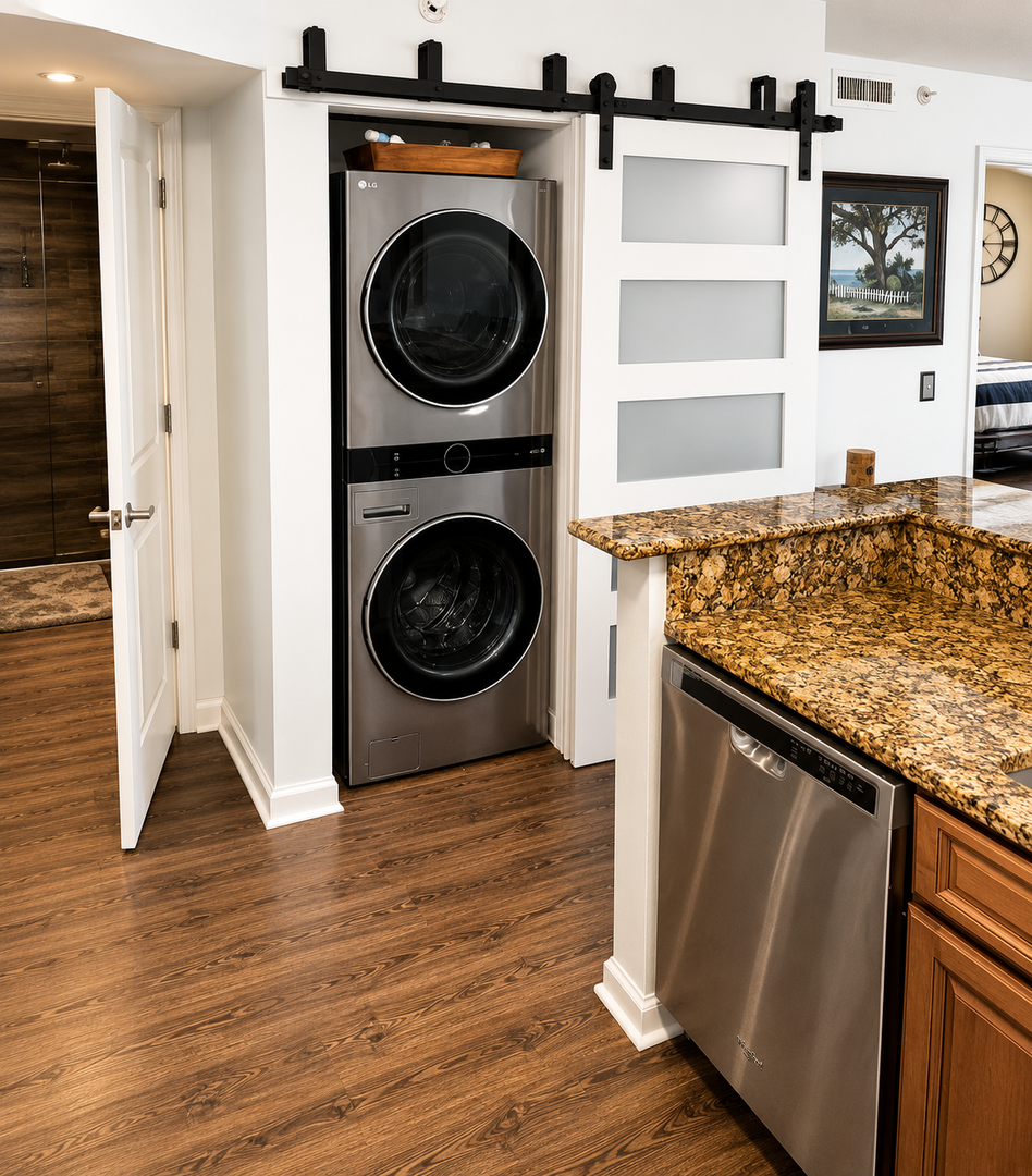 Enjoy hassle-free stays with your own in-unit washer and dryer tucked behind stylish barn doors, plus modern kitchen conveniences including a granite-topped island and stainless appliances at your fingertips.