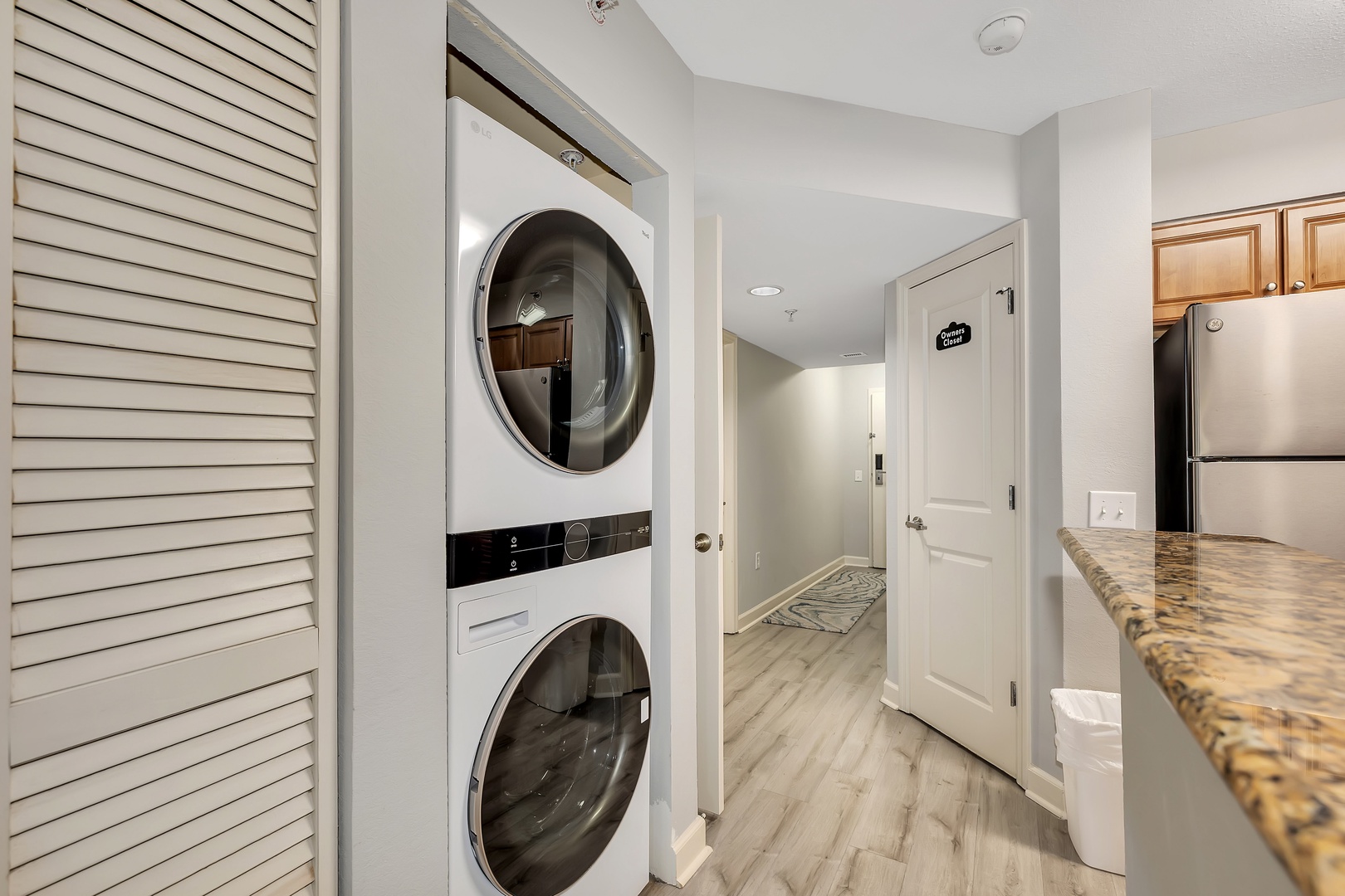 You'll appreciate the convenience of your own in-unit washer and dryer, tucked neatly into a closet near the kitchen for easy access during your stay.