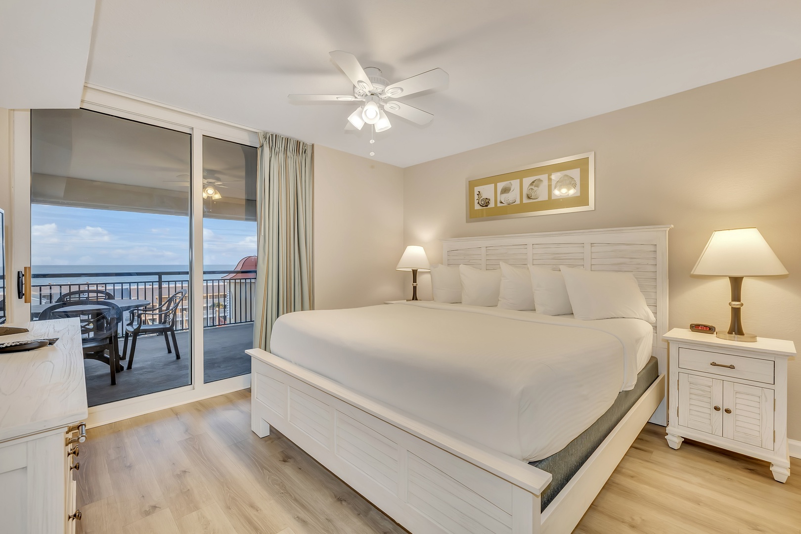 Wake up to breathtaking ocean views from your private balcony. Coastal charm meets comfort with crisp white linens and soothing coastal décor, perfect for your seaside retreat.