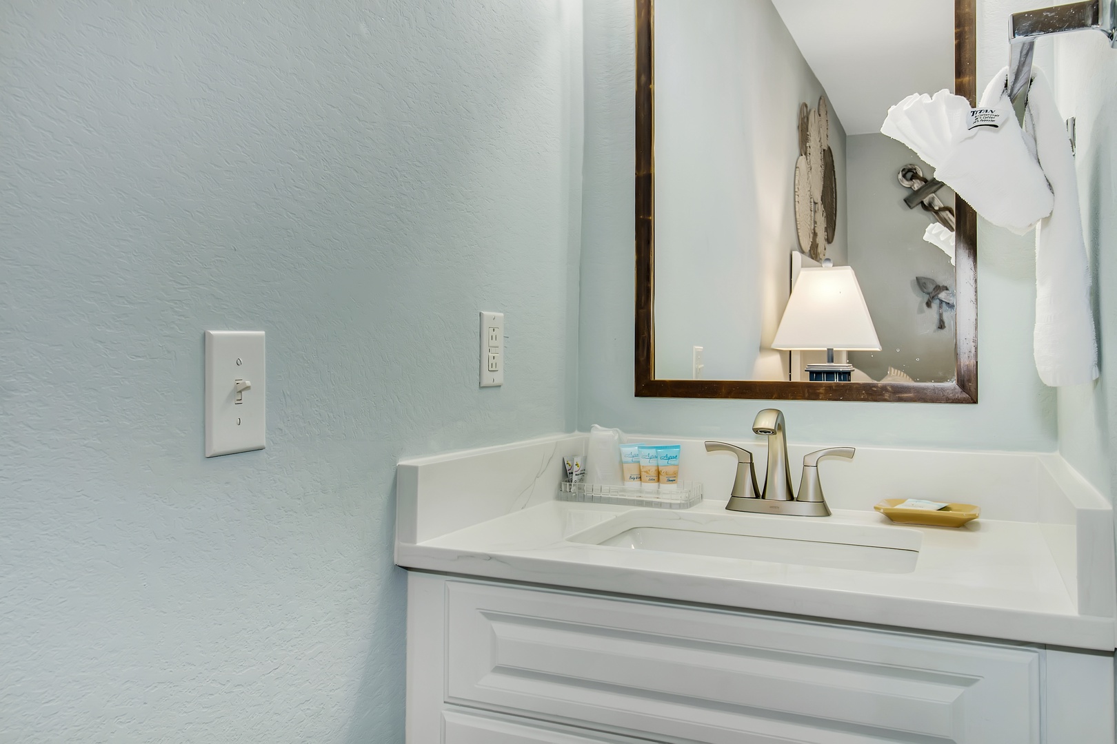 Your bright bathroom features a spacious vanity with premium amenities and fresh towels waiting for your arrival.