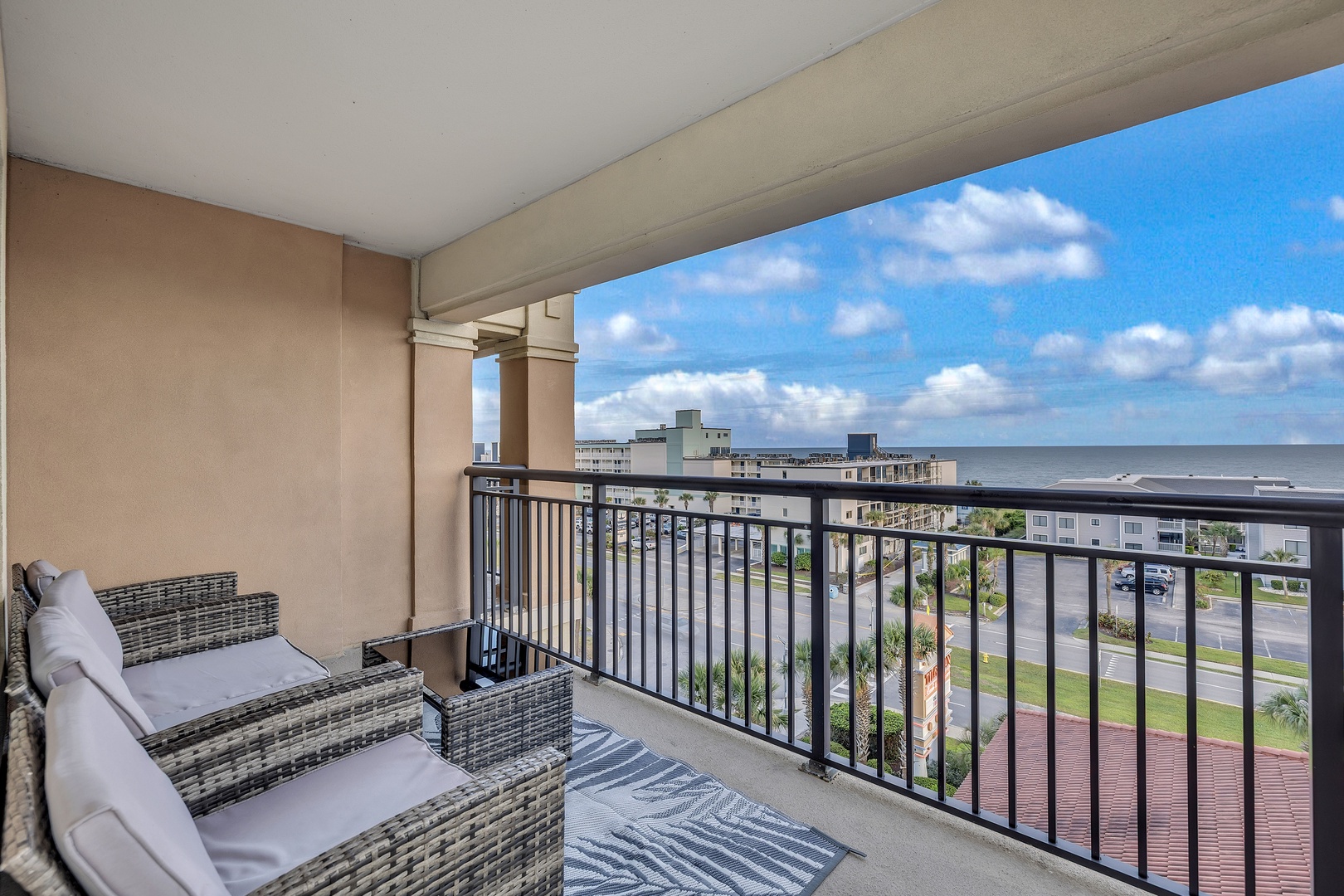 Step onto your private balcony and breathe in the coastal air while taking in sweeping ocean views. Plush seating invites you to unwind with morning coffee or evening sunsets, all framed by the beauty of your beachside retreat.