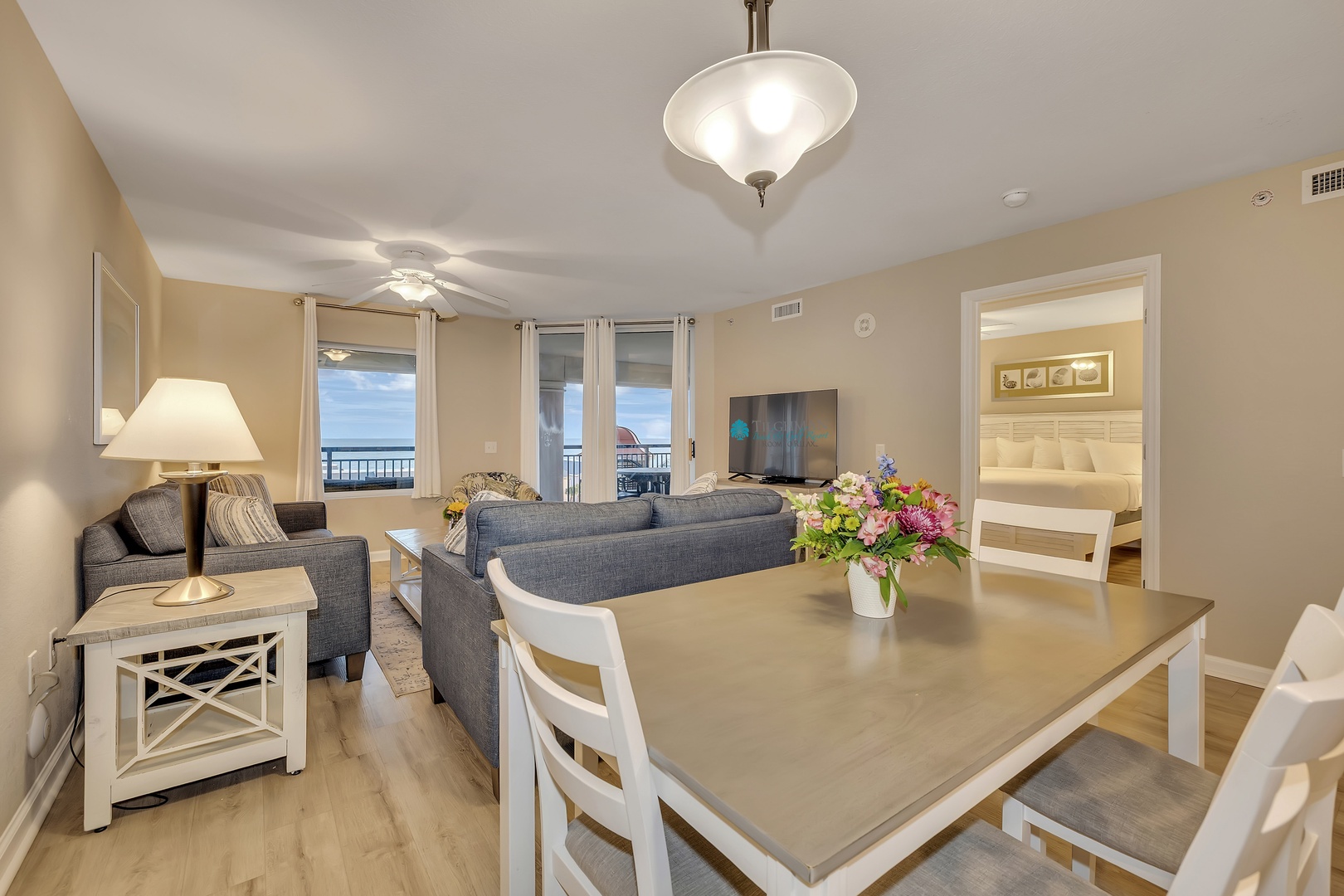 Relax in this bright, open living space where casual elegance meets coastal charm. Your dining area flows into a cozy lounge, and fresh ocean breezes await just beyond the windows.
