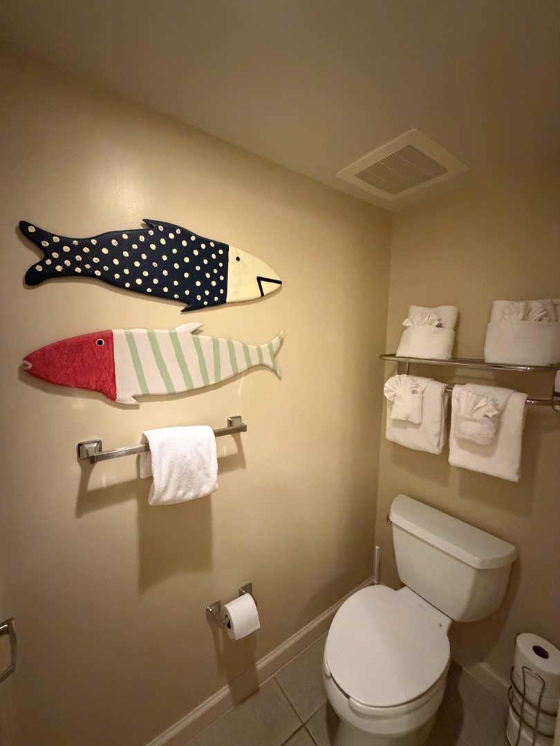Your private bathroom features playful nautical touches and fresh towels for your comfort.