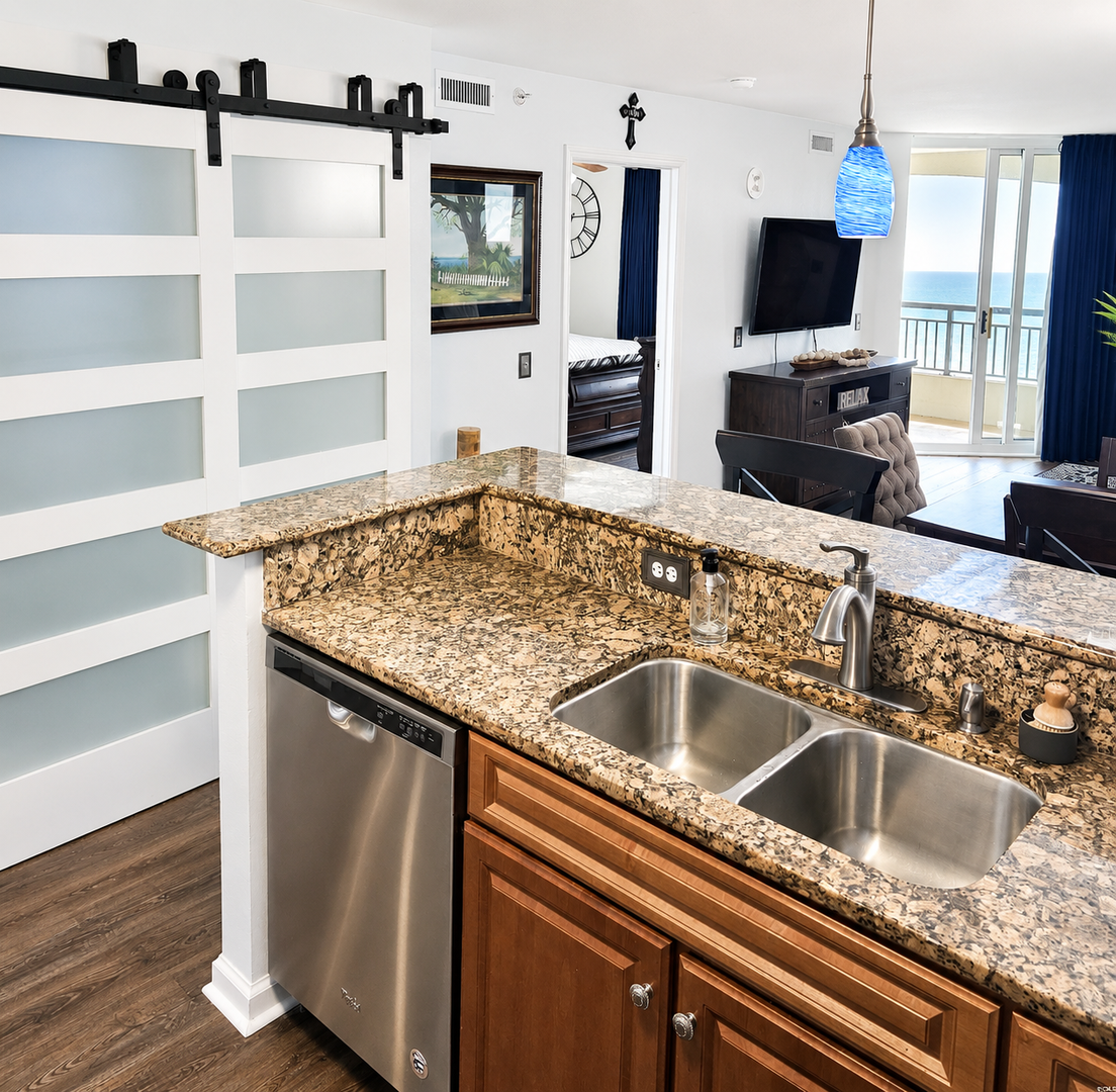 Your open-concept kitchen flows into your living space, where stunning ocean views greet you from the balcony, making every meal feel like a coastal escape.