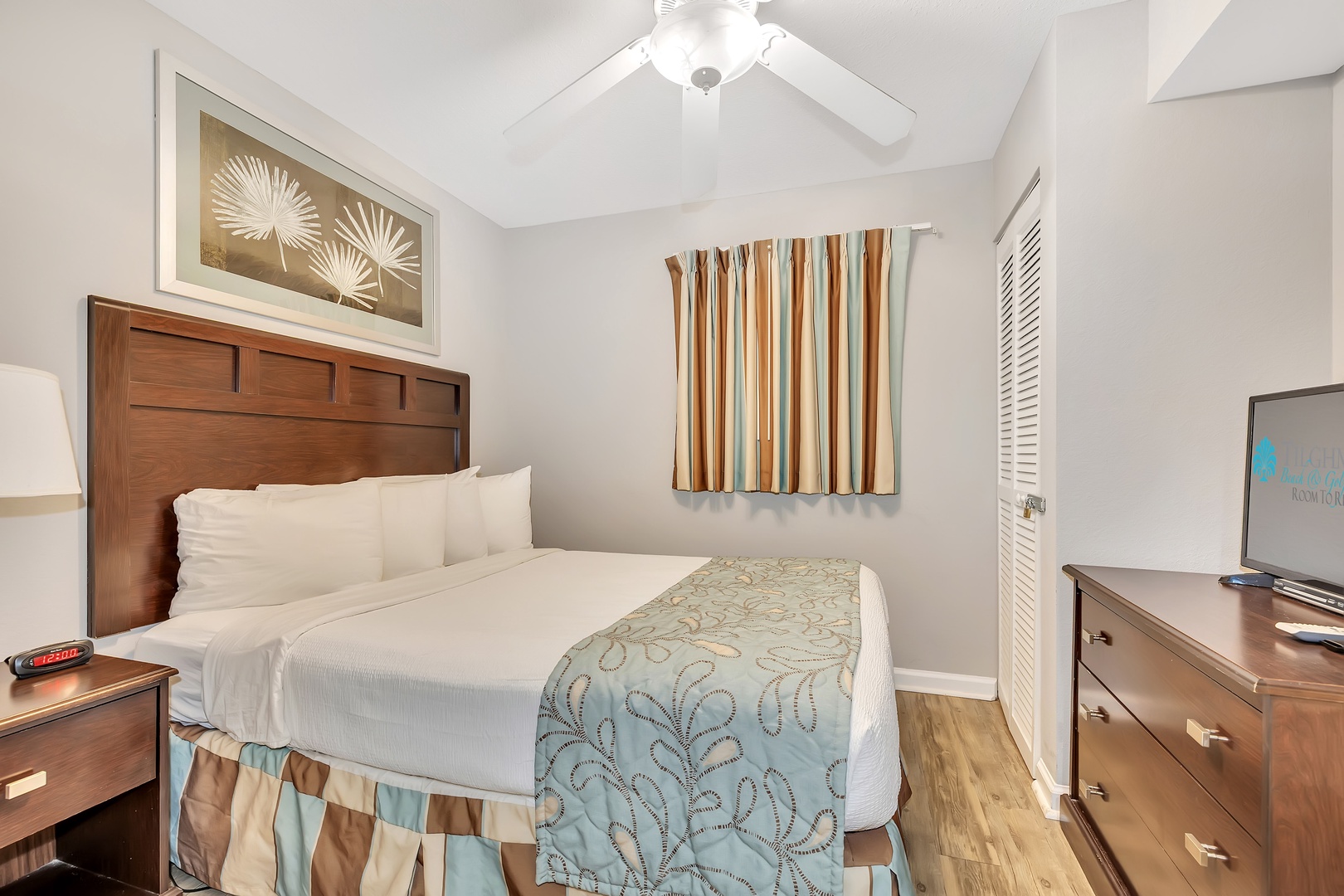 Slip into your peaceful retreat with crisp linens, coastal accents, and a gentle ceiling fan keeping you cool all night long.