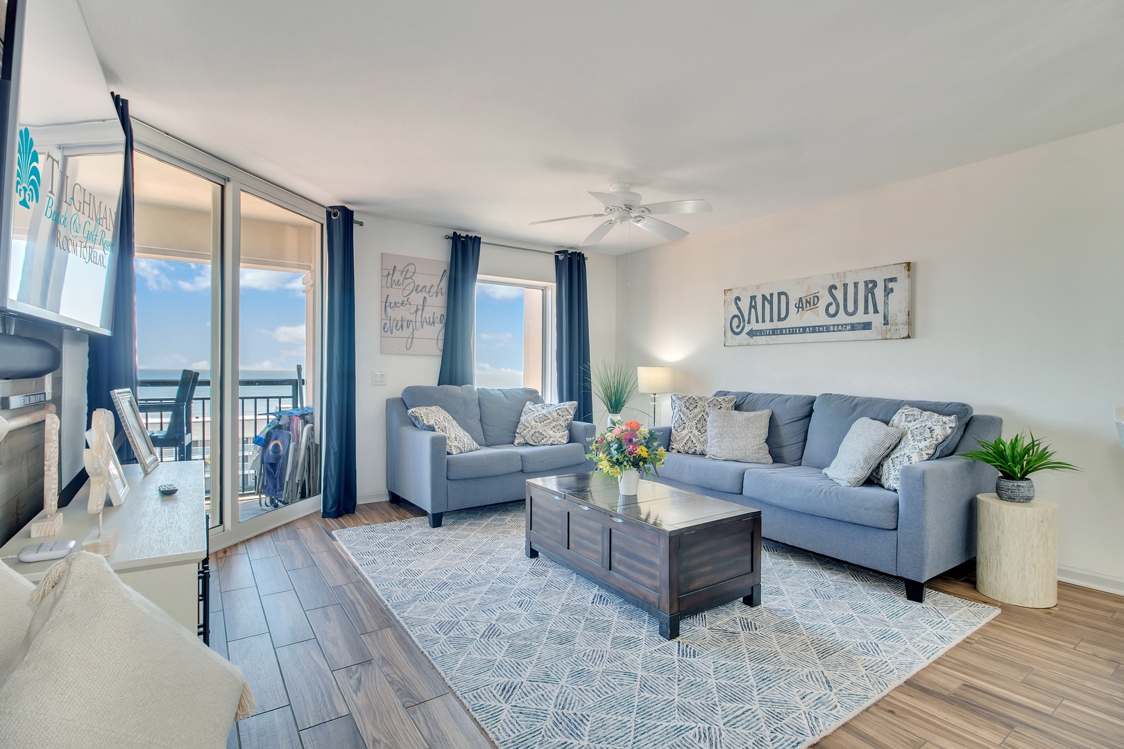 Unwind in your coastal living room where soft blue furnishings and beachy decor create the perfect retreat after ocean adventures.