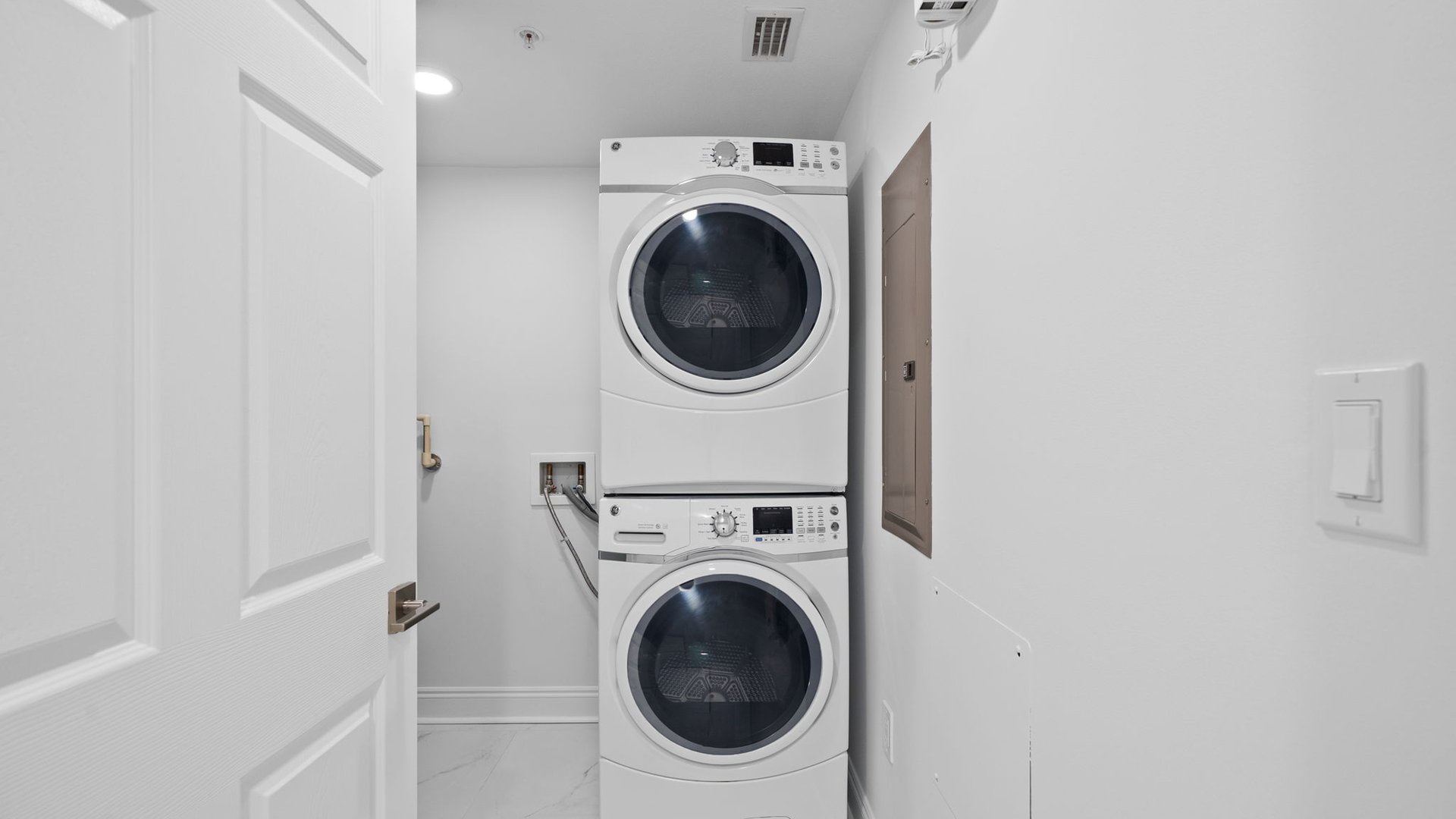 Your in-unit laundry closet features stacked washer and dryer for ultimate convenience during your stay.