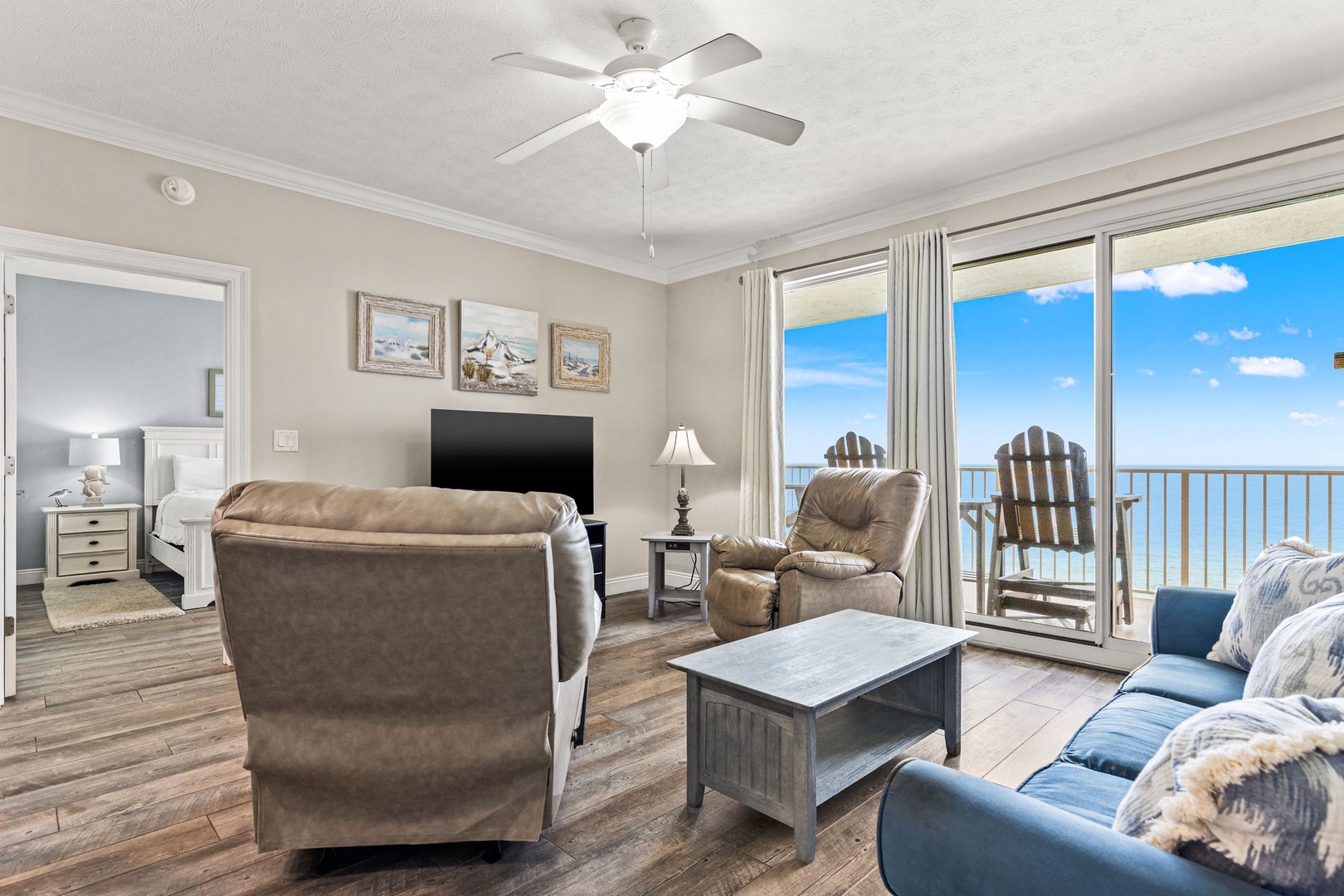 Relax in your comfortable living space with stunning oceanfront views. Spacious seating lets you unwind while endless blue waters stretch before you, and your private balcony invites you to step outside anytime.