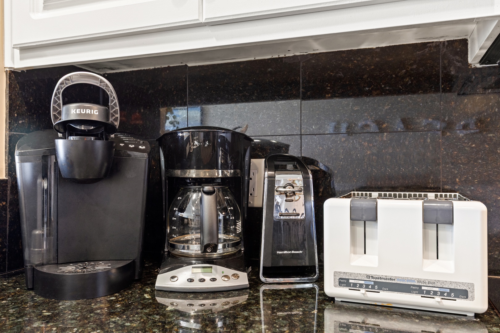 Start your mornings perfectly with your own coffee station featuring Keurig, drip coffee maker, and fresh toast ready whenever you need it.