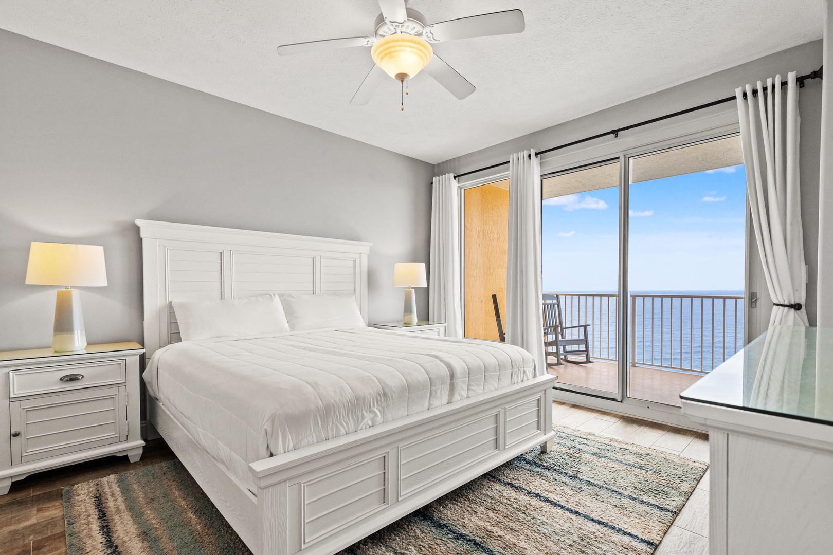 Drift off to the sound of waves in your serene coastal retreat, where crisp linens, soothing tones, and a breathtaking sea view create your perfect escape.