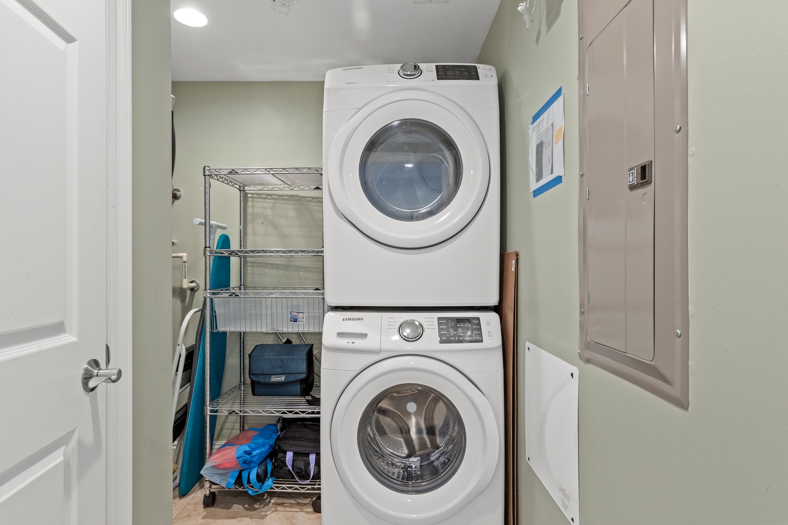 Your private laundry room keeps your vacation wardrobe fresh with full-sized washer and dryer, plus organized storage shelving.