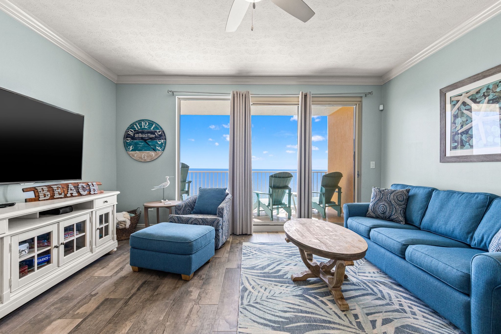 Relax in your comfortable living space with coastal decor and breathtaking ocean views through sliding glass doors that lead to your private balcony.