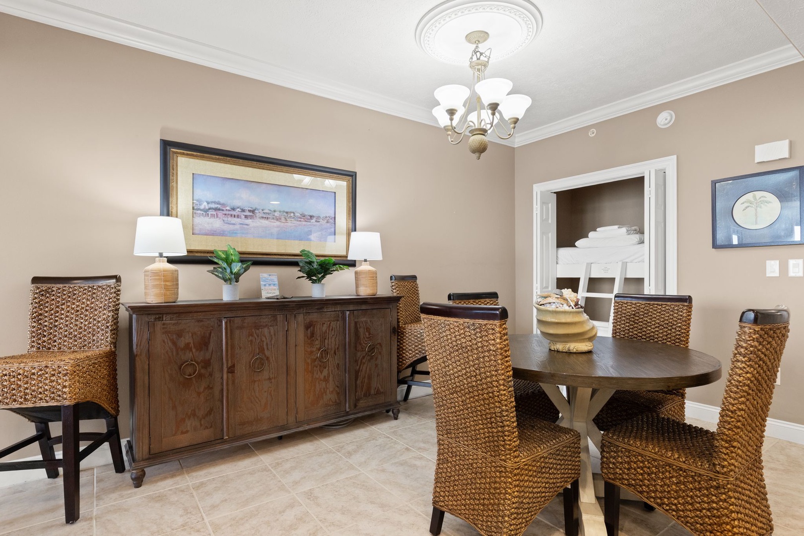 Gather around this elegant dining space with natural textures and warm lighting, perfect for sharing meals and making memories with your group.