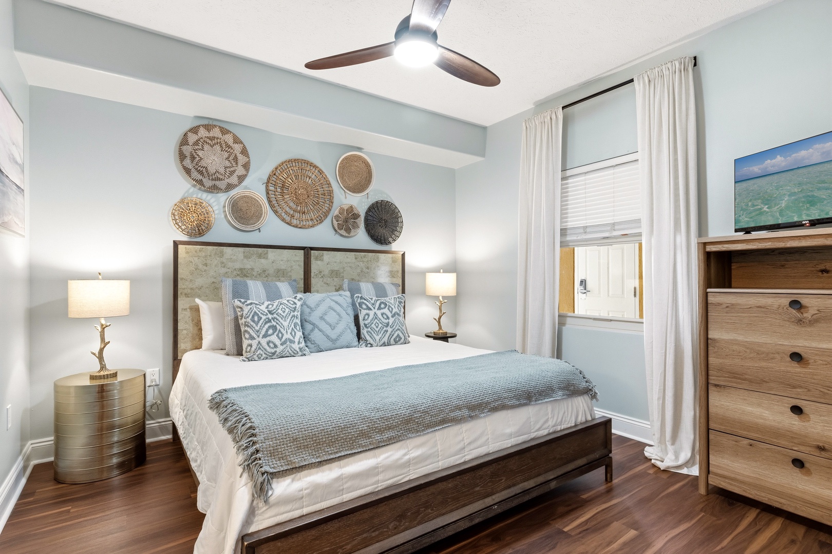 Drift off to sleep in this serene bedroom where soft blues and natural textures create your perfect retreat.