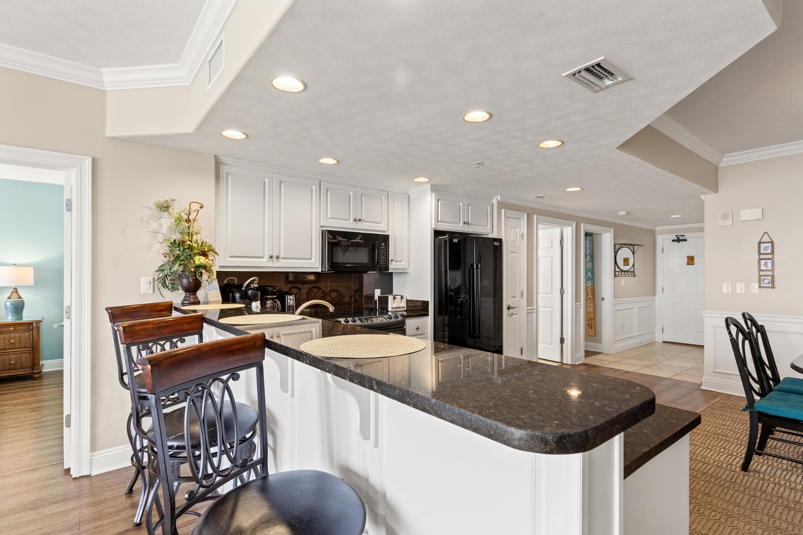 Your spacious gourmet kitchen features elegant granite countertops and premium appliances, perfect for creating memorable meals together.