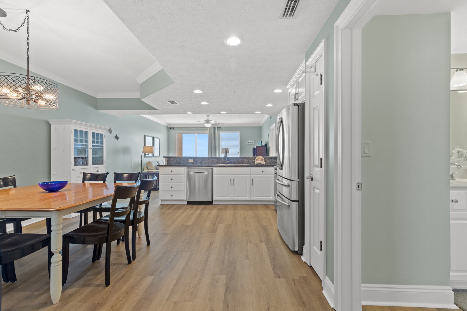 Your spacious kitchen flows seamlessly into the dining area, creating the perfect space for cooking and sharing meals together.