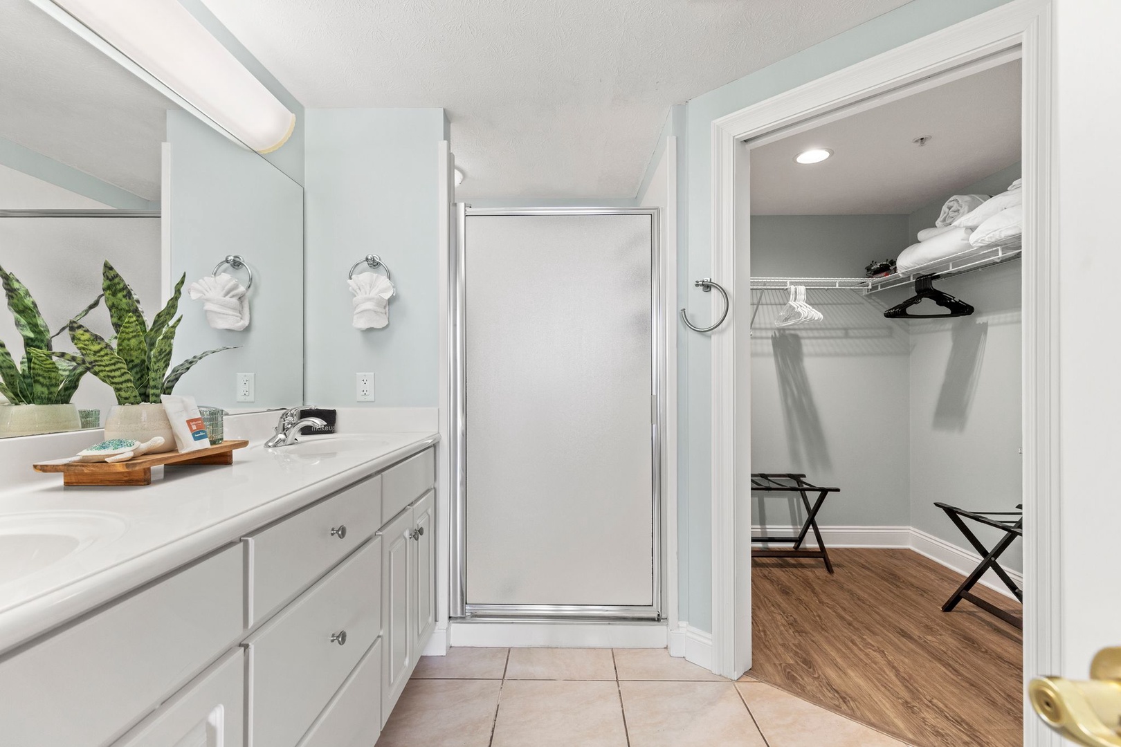 Freshen up in your private bathroom with ample counter space and handy closet storage. Coastal touches and thoughtful details make mornings effortless and relaxing.