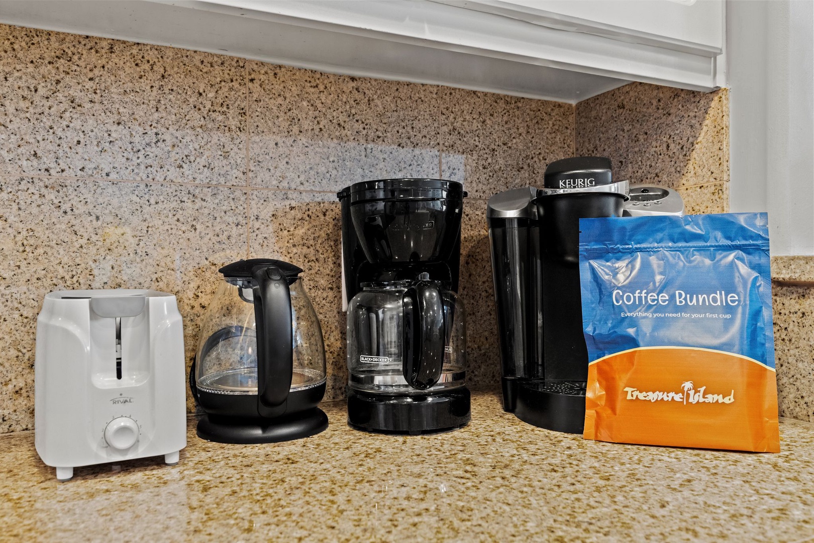 Start your mornings right with freshly brewed coffee from this well-equipped station, featuring a Keurig, drip coffee maker, and complimentary coffee bundle for your convenience.